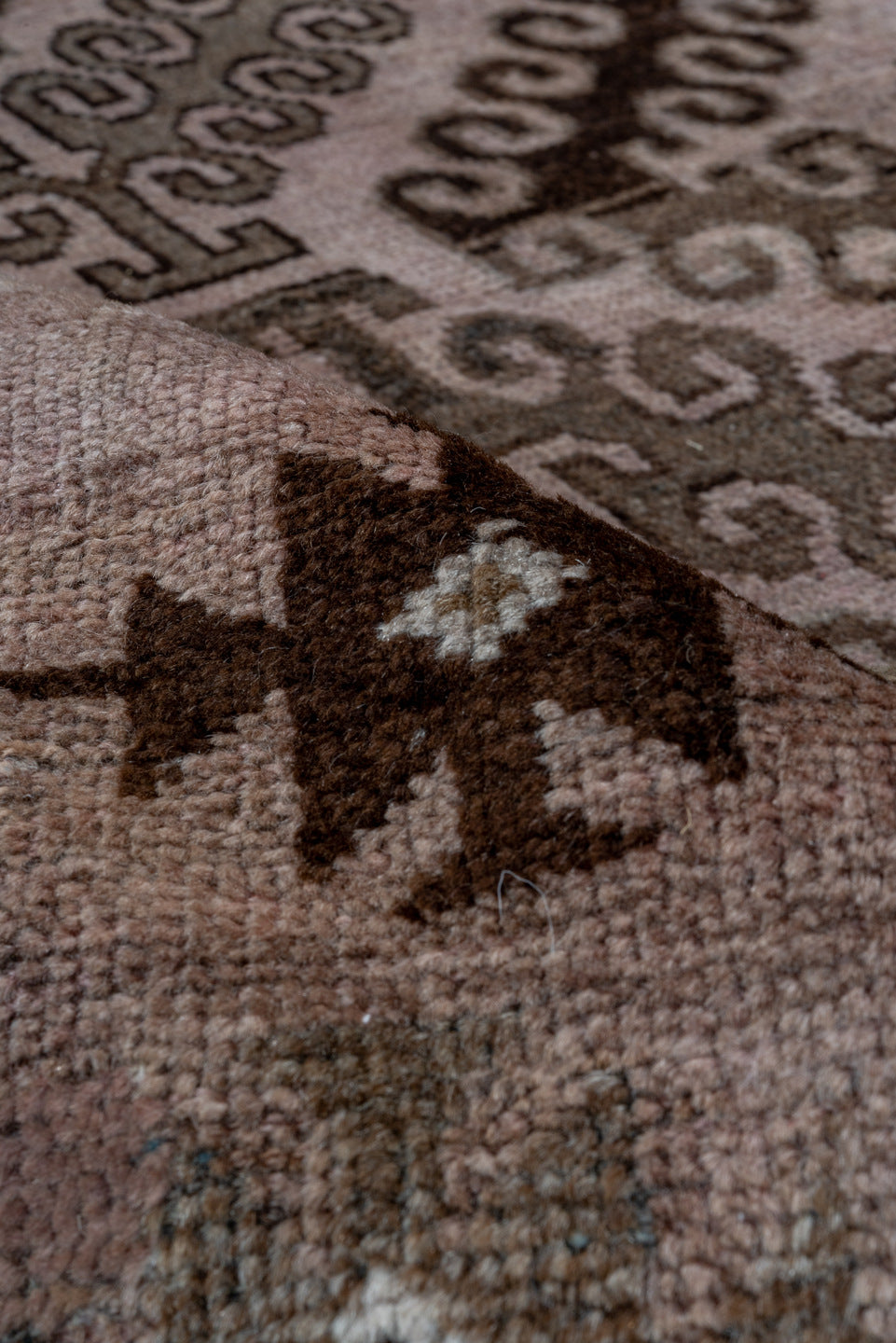 5' x 8' one-of-a-kind handmade antique Belouch medium size rug. Color palette: taupe, brown, charcoal, rose, rust, ivory