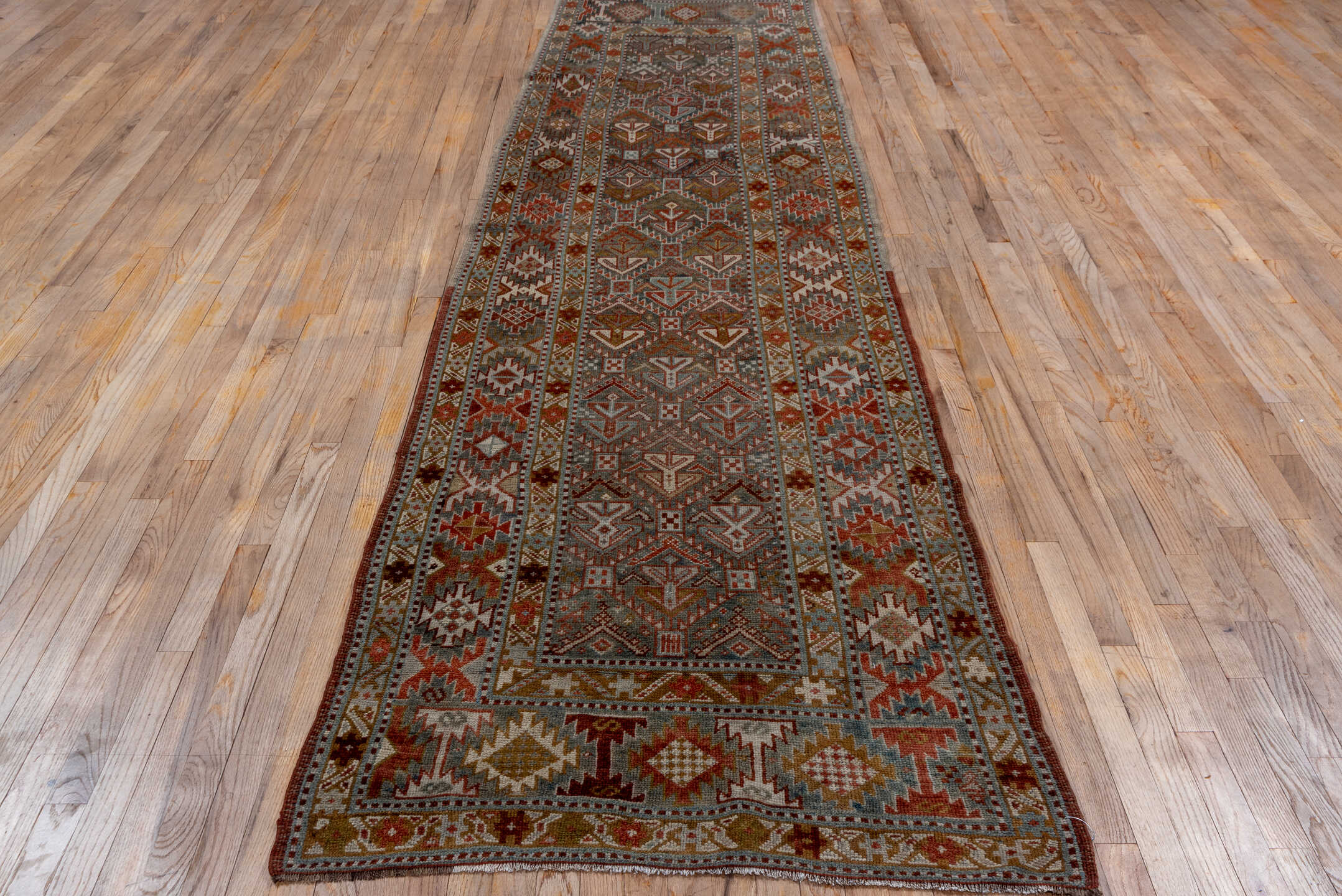 3' x 12' one-of-a-kind handmade vintage NW Persian runner rug. Color palette: black, brown, gray, pink, red