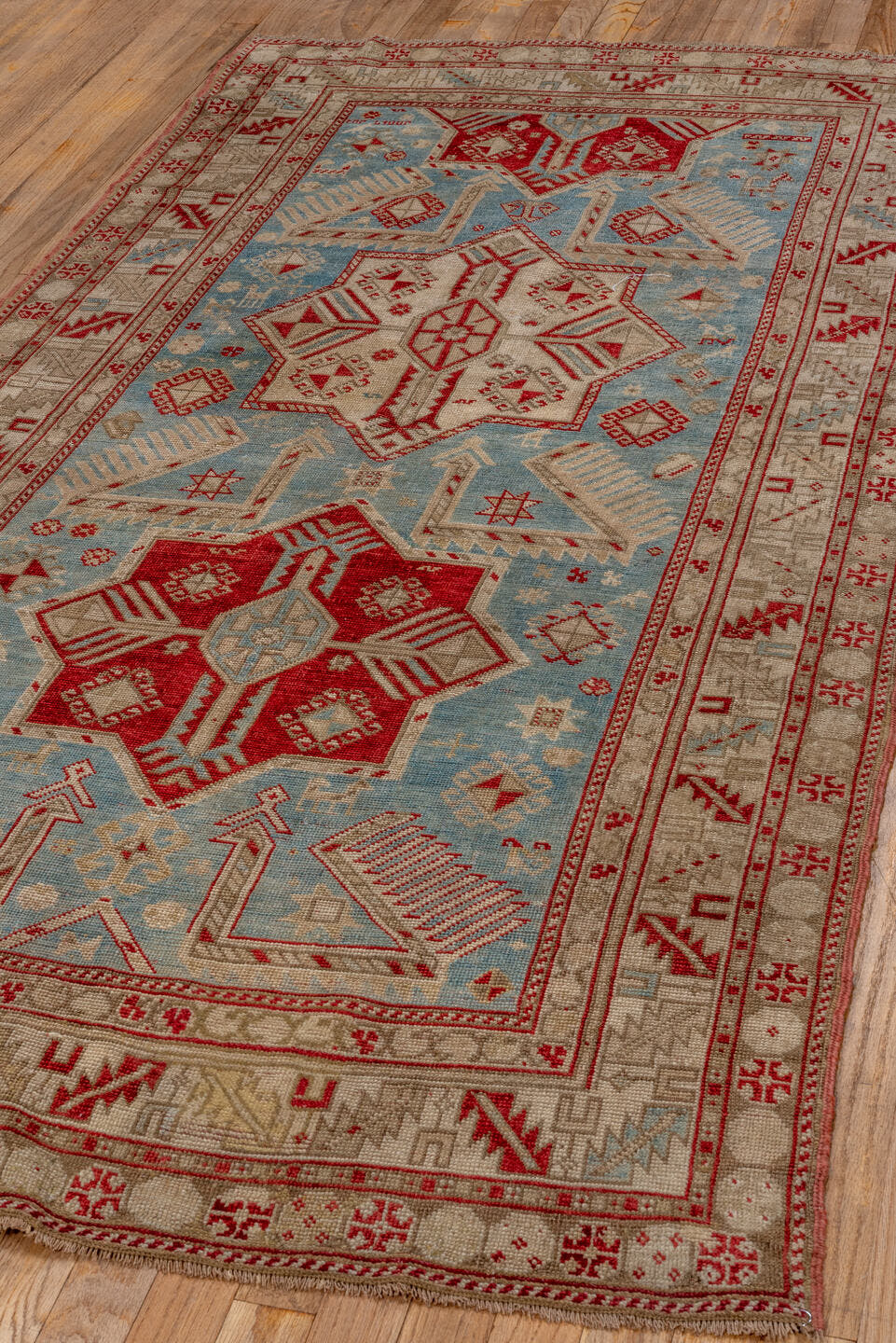3' x 7' one-of-a-kind handmade antique Caucasian runner rug. Color palette: ivory, sky blue, rust, beige, camel, crimson