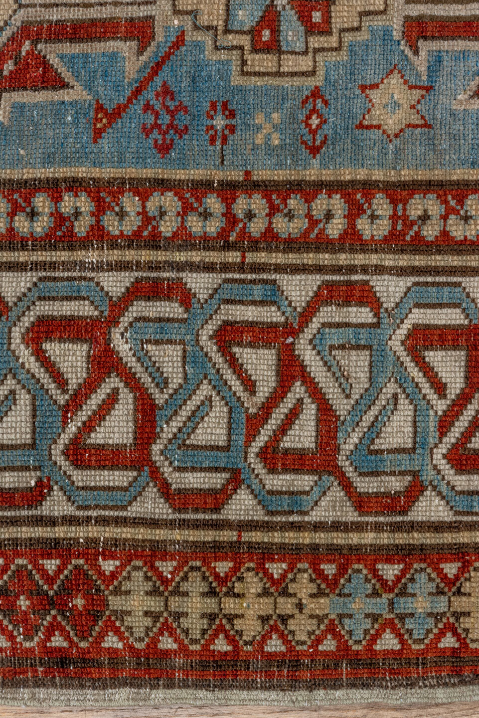 5' x 9' one-of-a-kind handmade antique Caucasian medium size rug. Color palette: light blue, ivory, rust, red, slate, camel