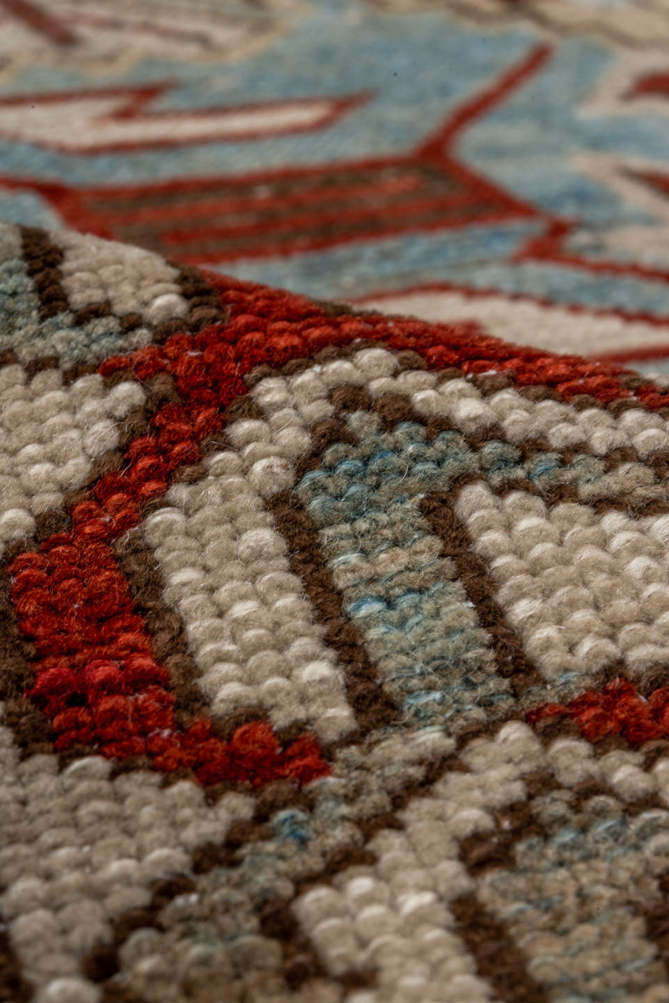 5' x 9' one-of-a-kind handmade antique Caucasian medium size rug. Color palette: light blue, ivory, rust, red, slate, camel