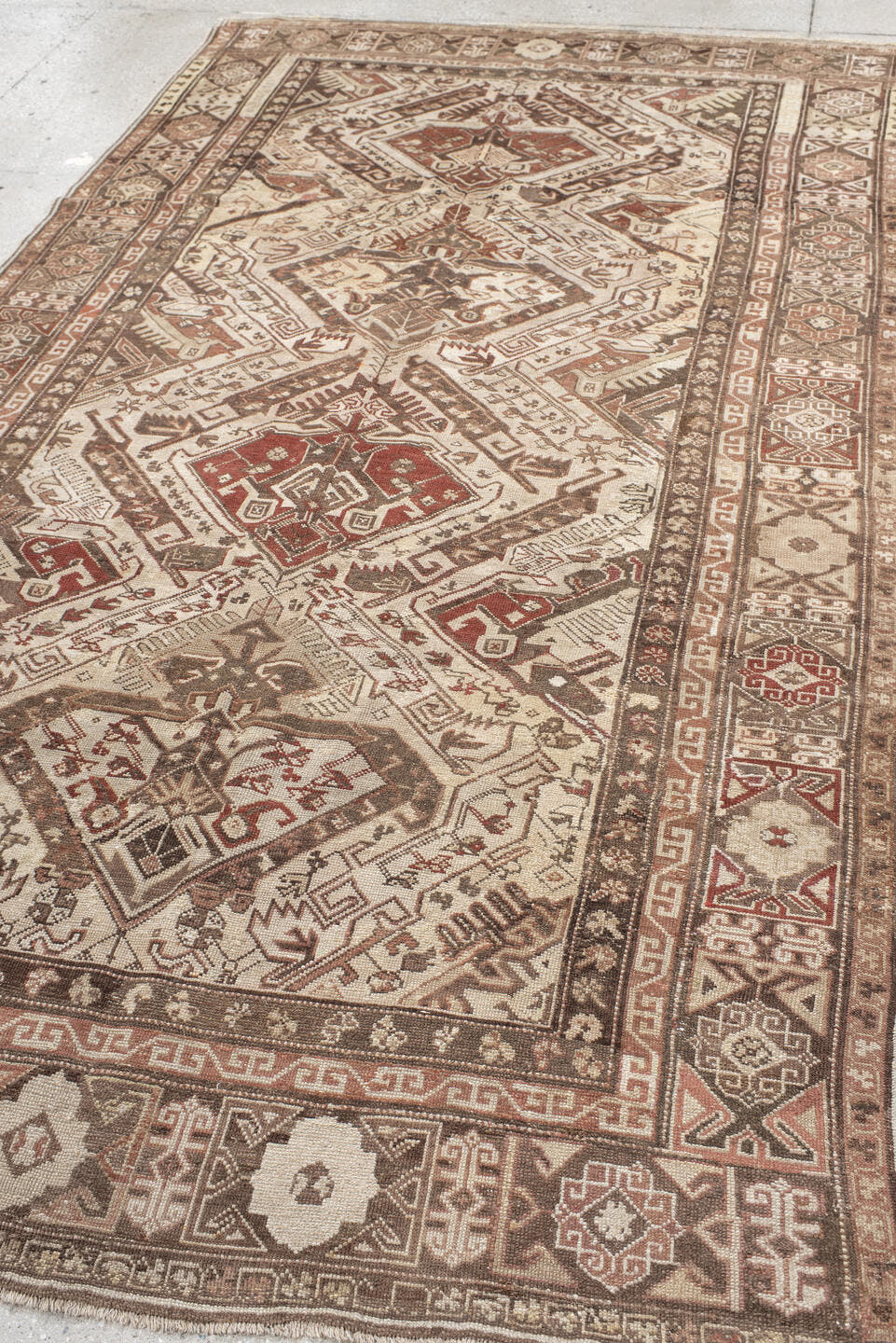 5' x 10' one-of-a-kind handmade vintage Caucasian medium size rug. Color palette: ivory, taupe, brown, rust, camel, rose