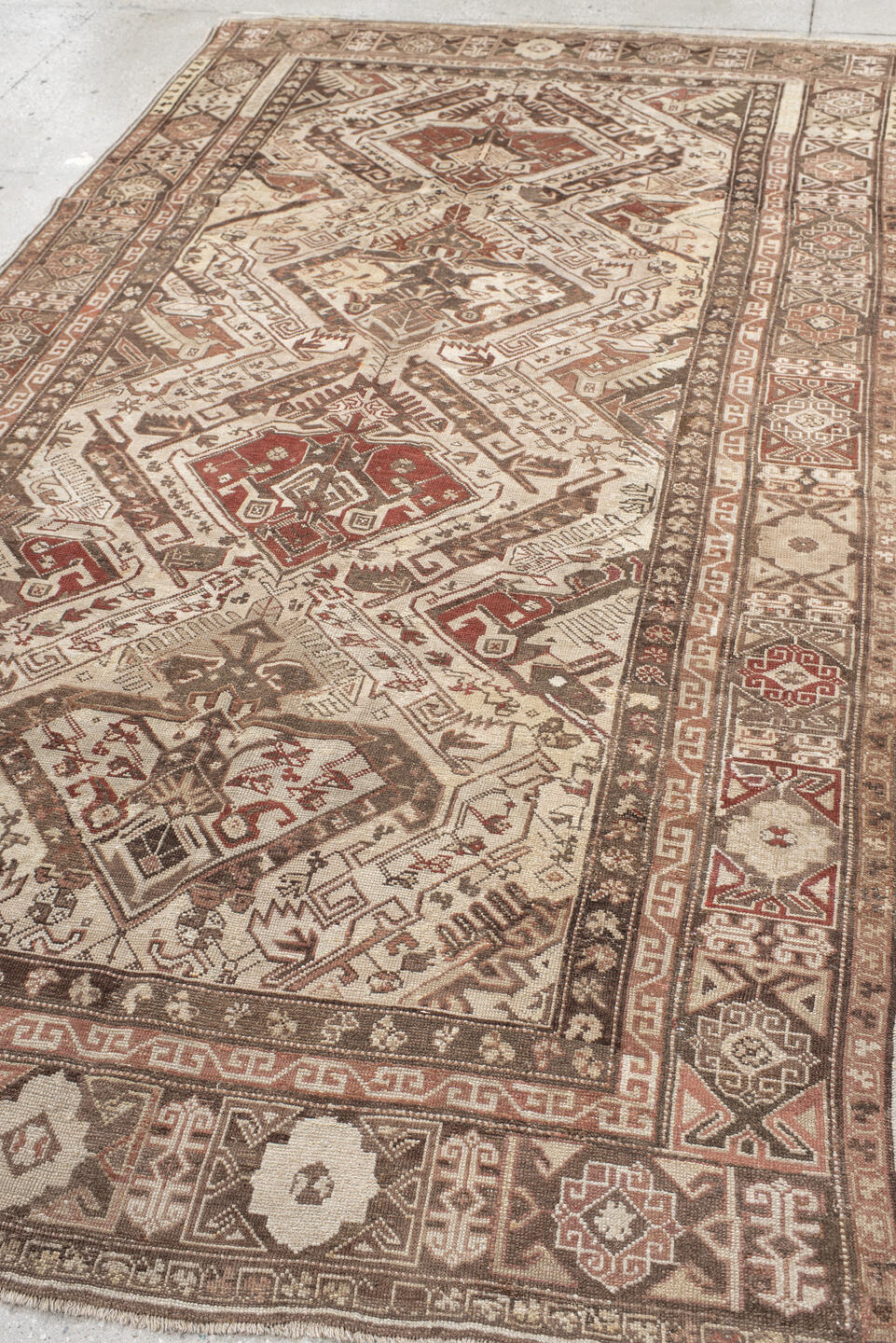 5' x 10' one-of-a-kind handmade vintage Caucasian medium size rug. Color palette: ivory, taupe, brown, rust, camel, rose