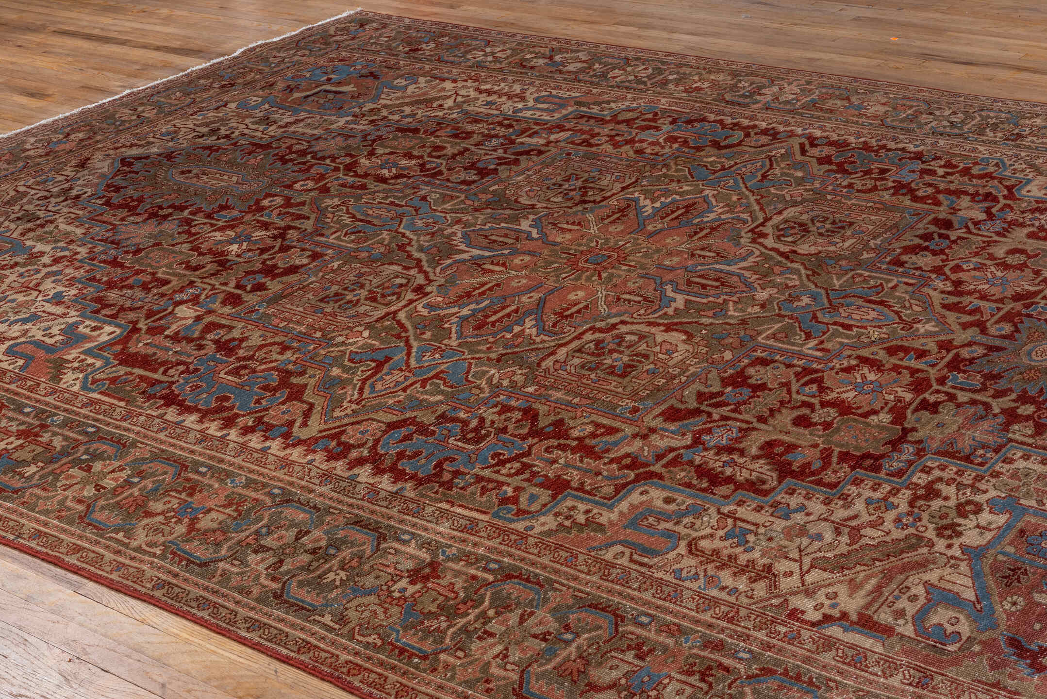 9' x 12' one-of-a-kind handmade antique Heriz large size rug. Color palette: rust, ivory, taupe, sky blue, brown, slate