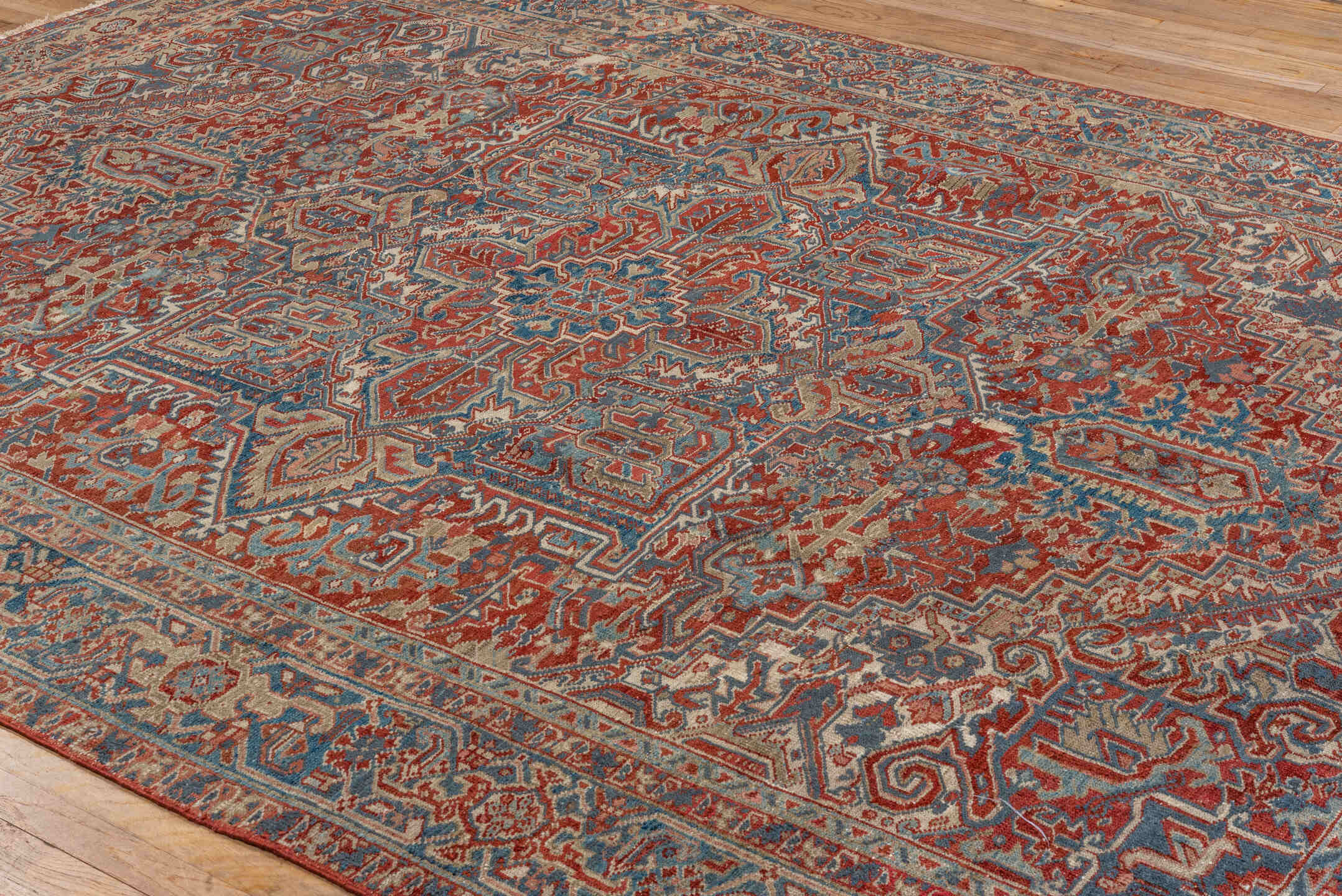 8' x 10' one-of-a-kind handmade antique Heriz large size rug. Color palette: rust, ivory, slate, navy, terra cotta, camel