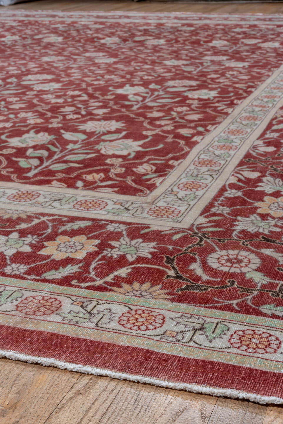 12' x 15' one-of-a-kind handmade antique Agra oversize rug. Color palette: red, ivory, rose, sage, taupe, pink, green, beige