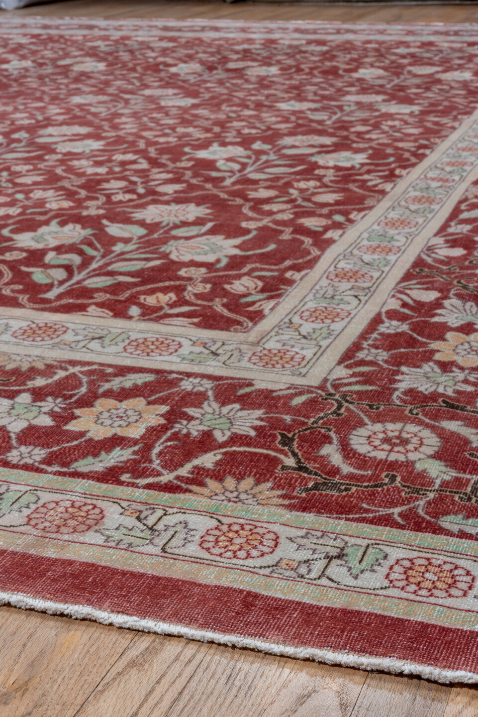 12' x 15' one-of-a-kind handmade antique Agra oversize rug. Color palette: red, ivory, rose, sage, taupe, pink, green, beige