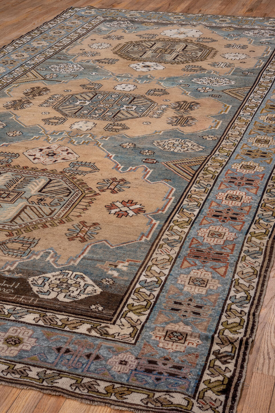6' x 12' one-of-a-kind handmade antique Caucasian large size rug. Color palette: ivory, sky blue, taupe, brown, slate, camel