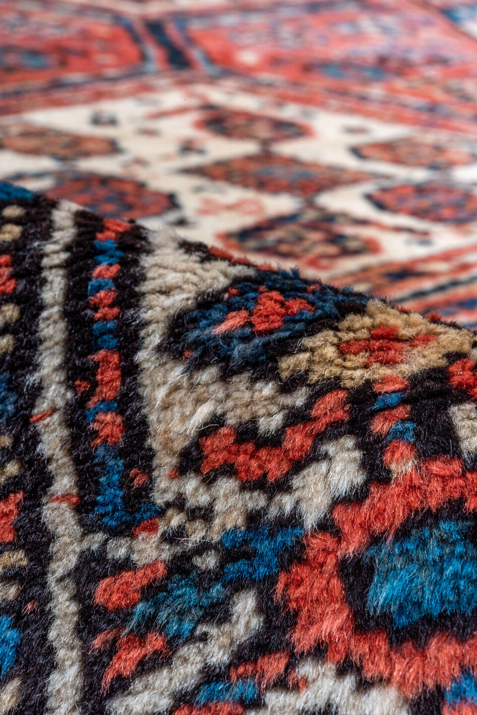 3' x 9' one-of-a-kind handmade antique NW Persian runner rug. Color palette: rust, indigo, ivory, navy, terra cotta, camel