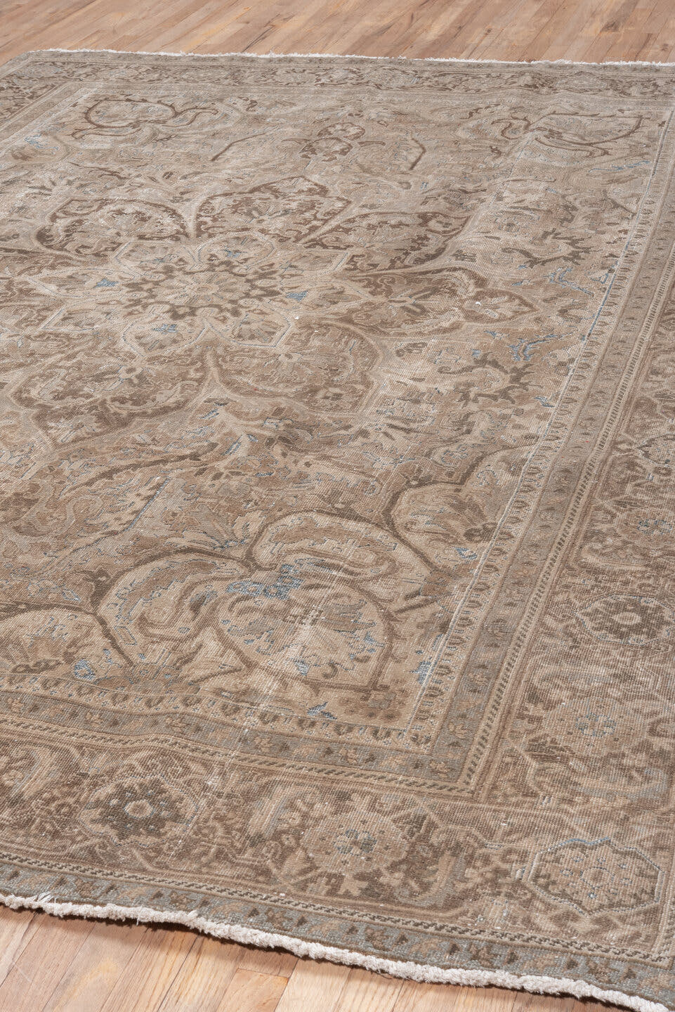 7' x 10' one-of-a-kind handmade vintage Heriz large size rug. Color palette: taupe, ivory, brown, beige, camel, pale blue
