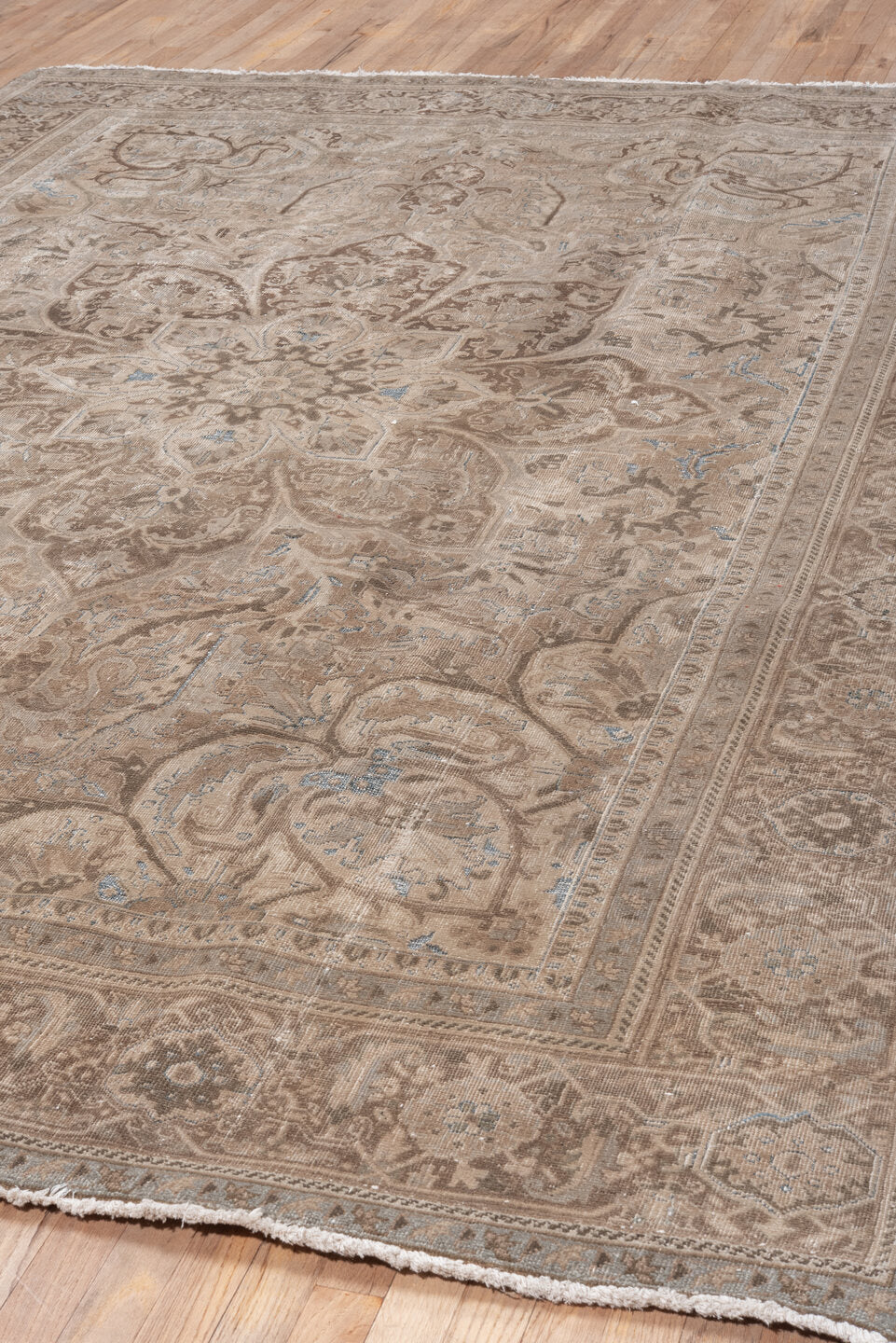7' x 10' one-of-a-kind handmade vintage Heriz large size rug. Color palette: taupe, ivory, brown, beige, camel, pale blue