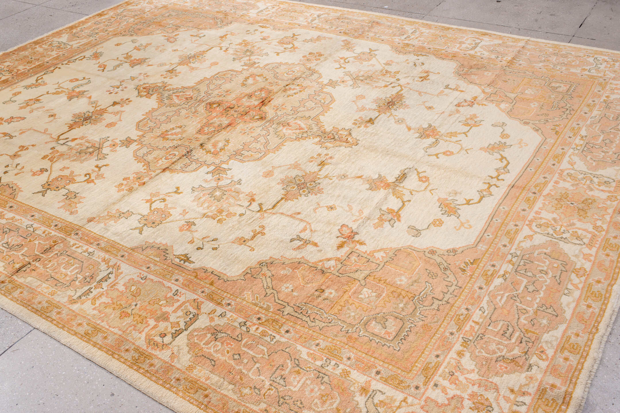 10' x 12' one-of-a-kind handmade antique Oushak large size rug. Color palette: ivory, peach, apricot, muted gold, taupe
