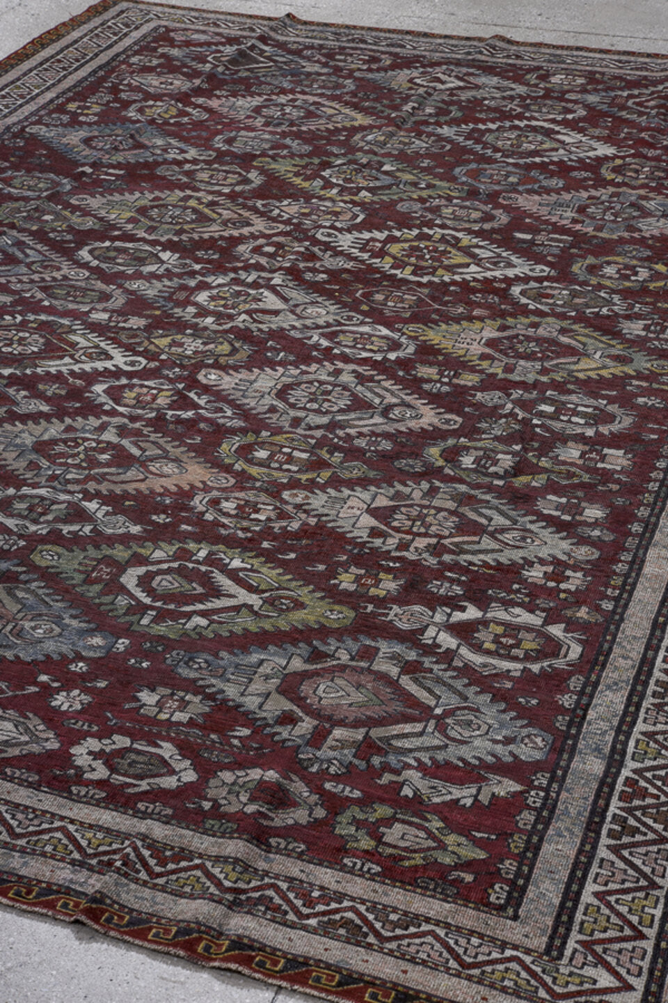 7' x 9' one-of-a-kind handmade vintage Sumak rug. Color palette: black, blue, brown, dark gray, dim gray, gray, light gray