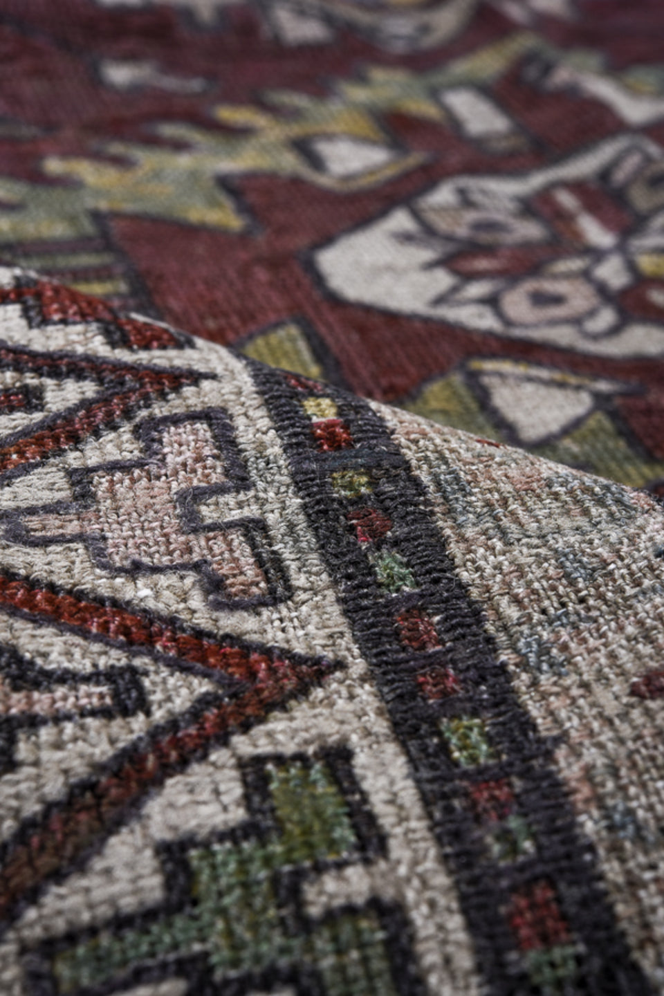 7' x 9' one-of-a-kind handmade antique Sumak rug. Color palette: rust, ivory, slate, sage, gold, charcoal, camel, terracotta