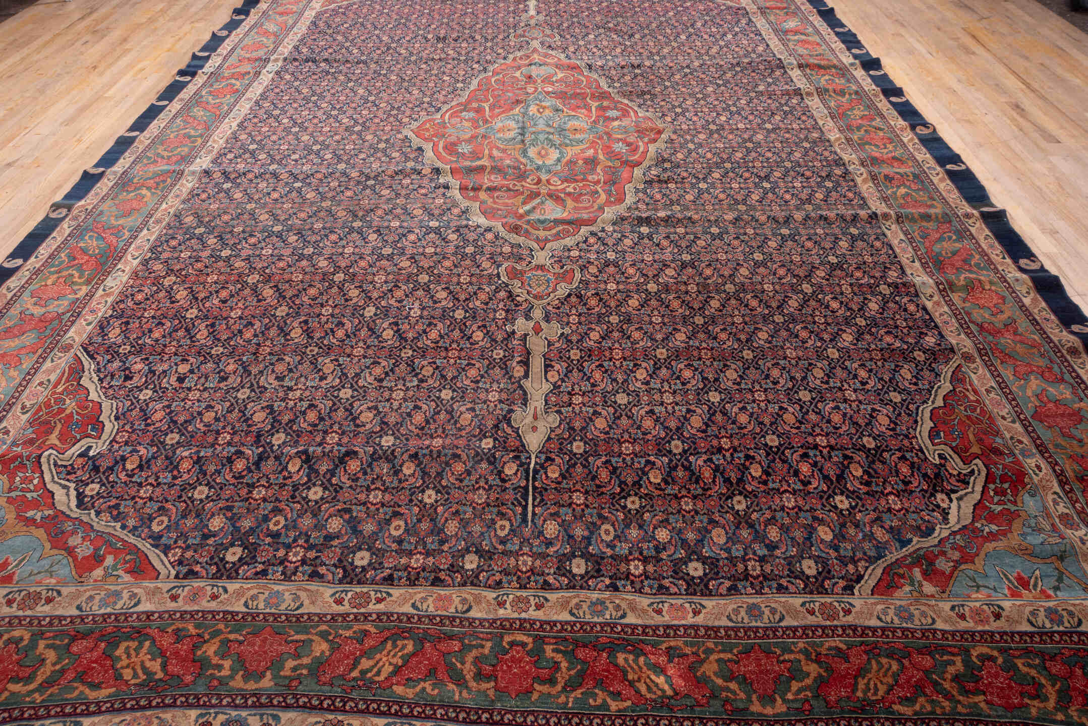 11' x 18' one-of-a-kind handmade antique Bidjar oversize rug. Color palette: navy, rust, ivory, soft blue, red, sage, camel