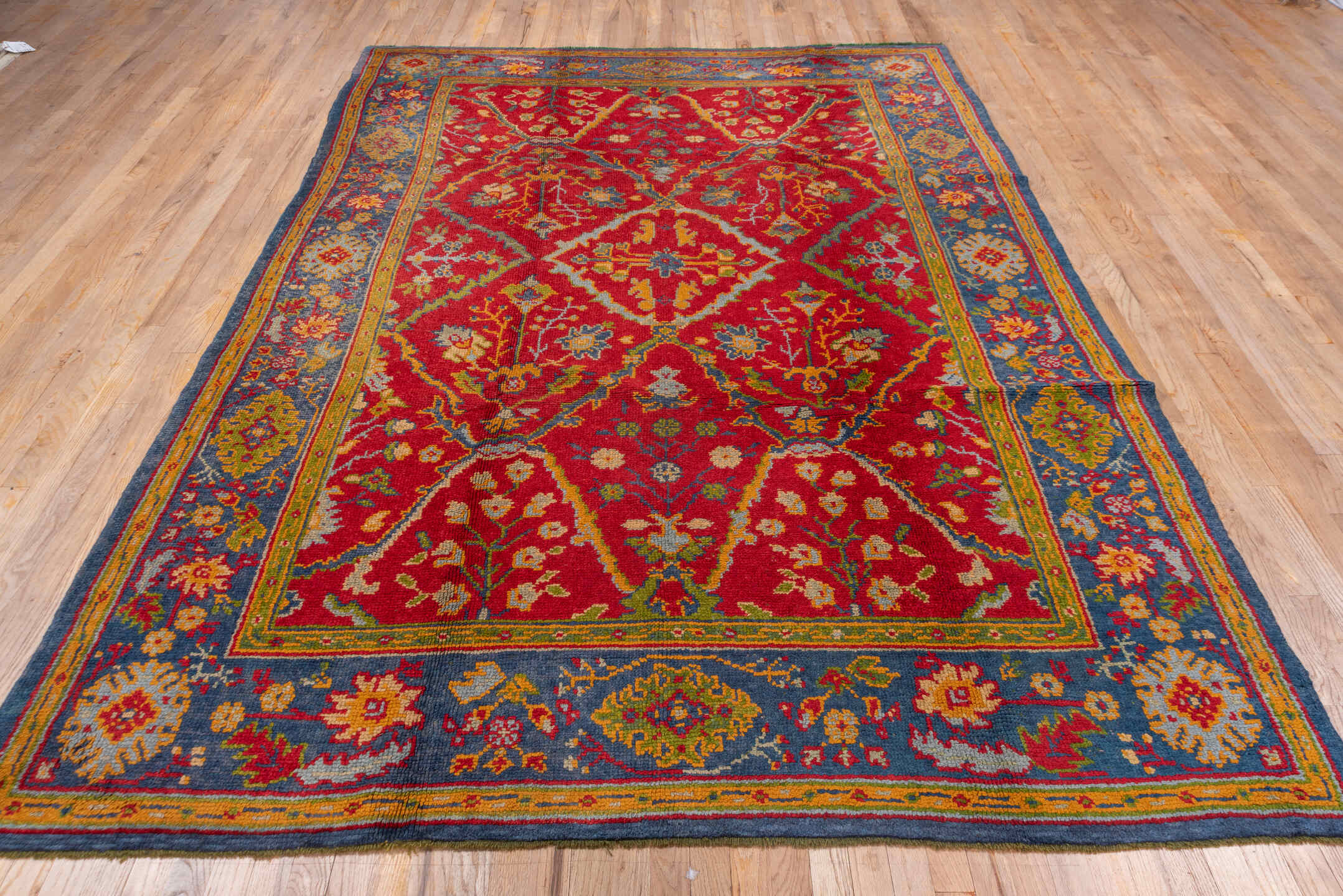 7' x 10' one-of-a-kind handmade vintage European large size rug. Color palette: red, blue, gold, ivory, sage, rust, olive