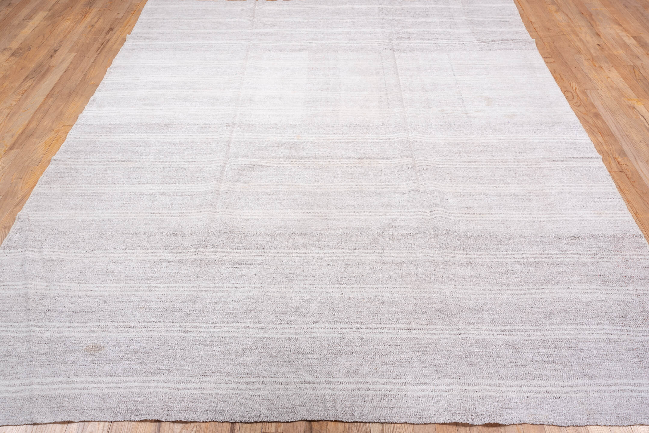 7' x 9' one-of-a-kind handmade vintage Flatweave rug. Color palette: ivory, cream, taupe, beige, light gray, gray