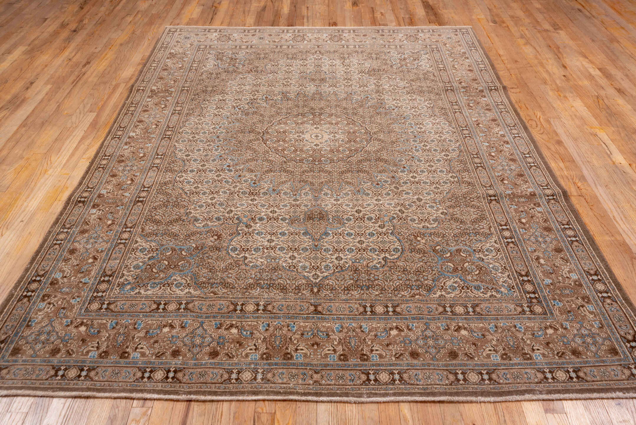 6' x 9' one-of-a-kind handmade antique Tabriz medium size rug. Color palette: taupe, camel, brown, ivory, pale_blue, beige