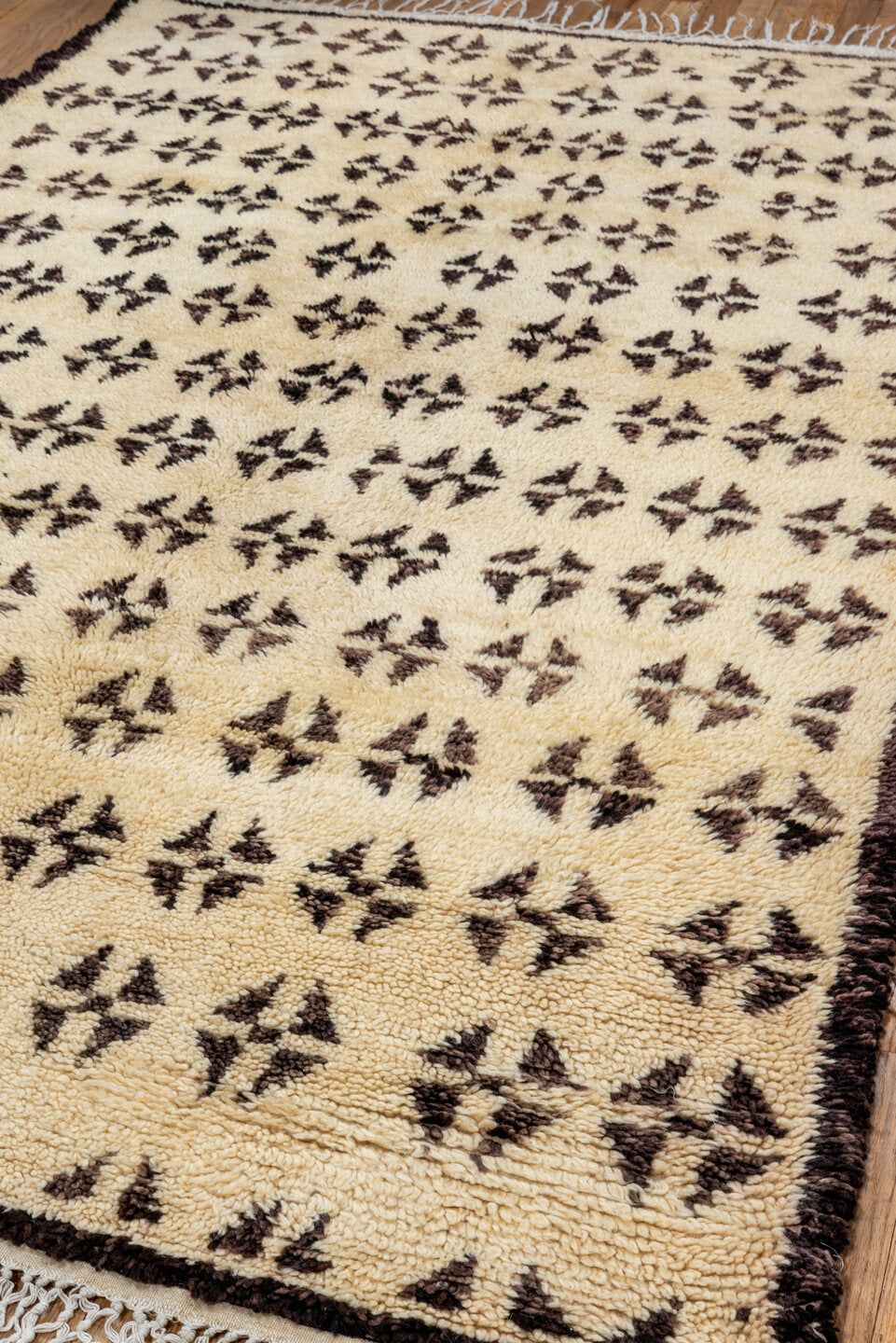 5' x 8' one-of-a-kind handmade vintage Moroccan medium size rug. Color palette: brown, gray, light gray, off-white, orange