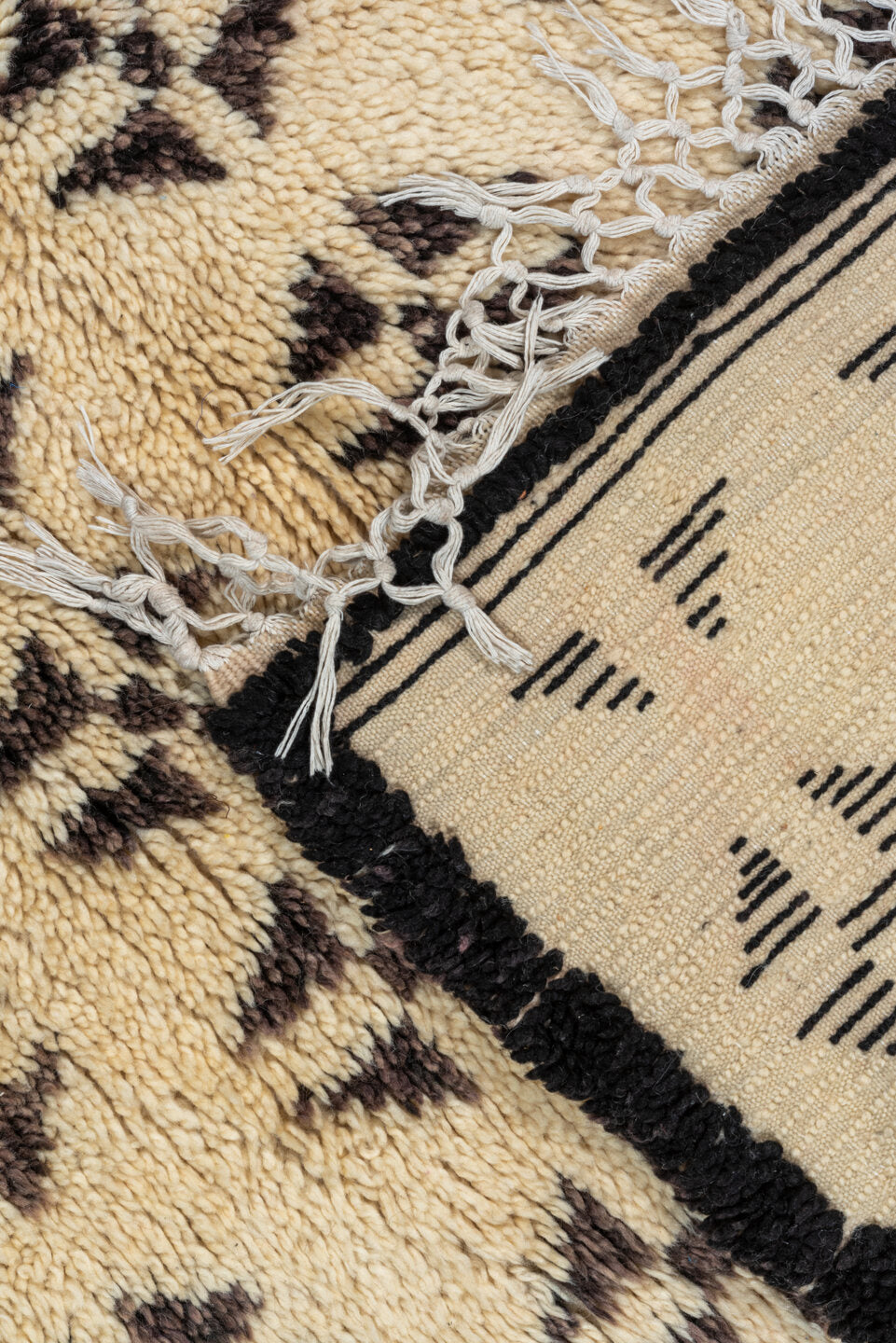 5' x 8' one-of-a-kind handmade vintage Moroccan medium size rug. Color palette: brown, gray, light gray, off-white, orange