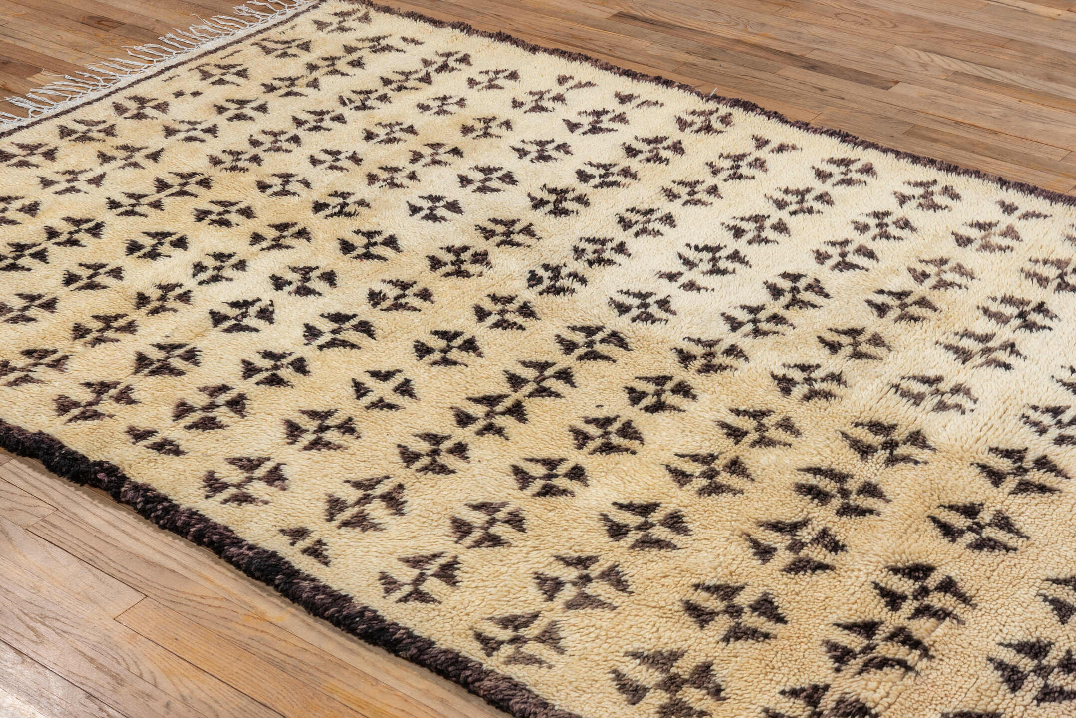 5' x 8' one-of-a-kind handmade vintage Moroccan medium size rug. Color palette: brown, gray, light gray, off-white, orange