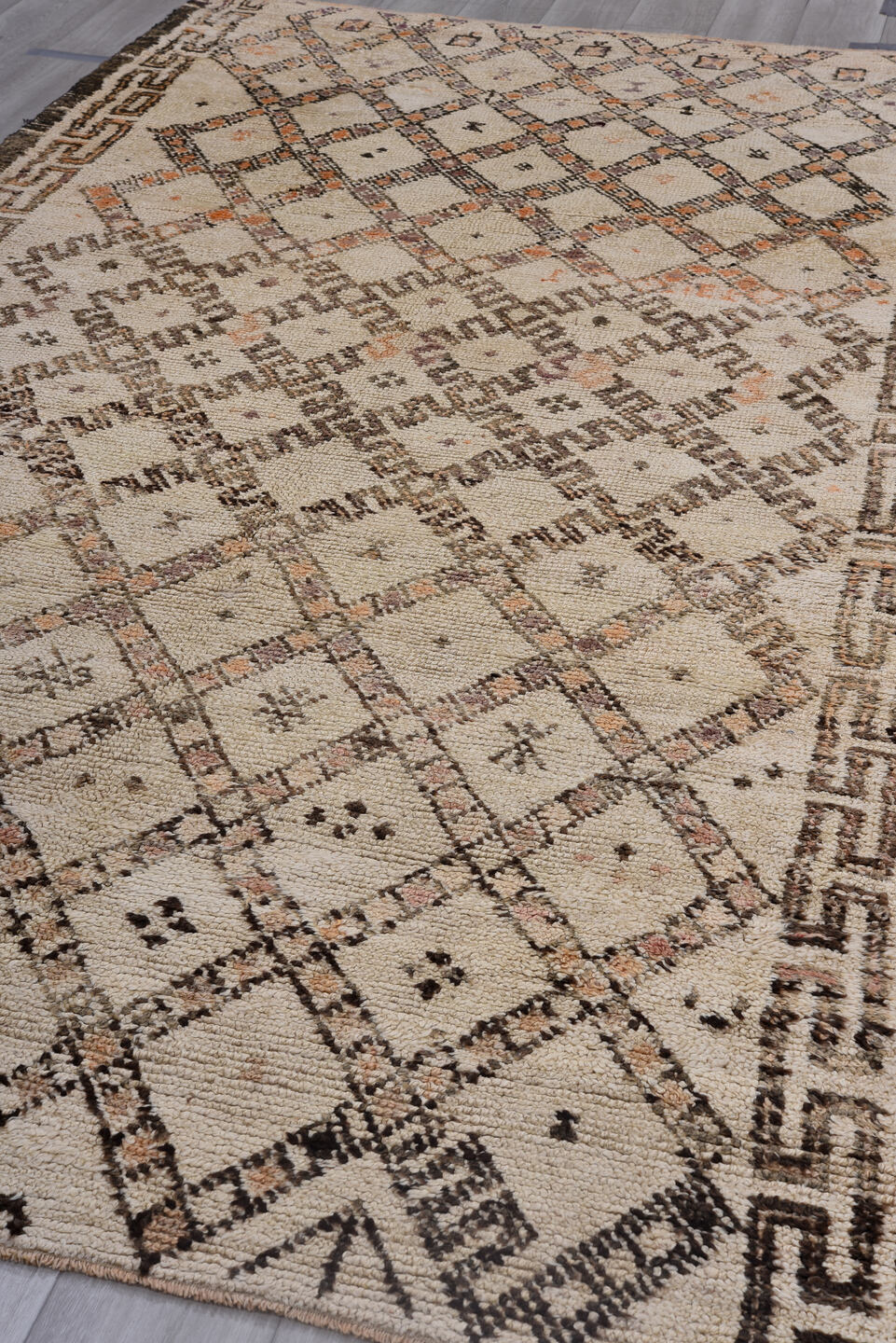 5' x 11' one-of-a-kind handmade vintage Moroccan rug. Color palette: black, brown, gray, light gray, off-white, pink, snow