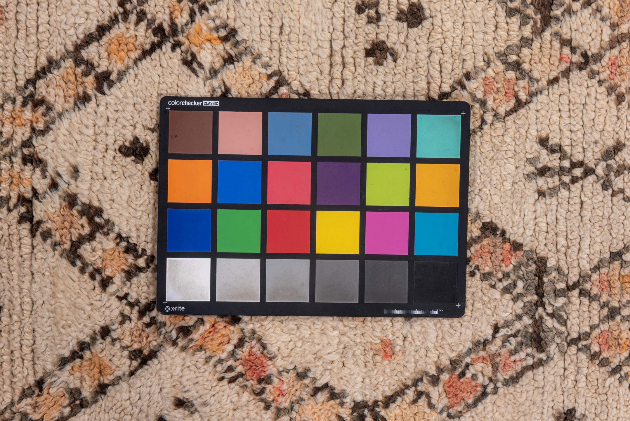 5' x 11' one-of-a-kind handmade vintage Moroccan rug. Color palette: black, brown, gray, light gray, off-white, pink, snow