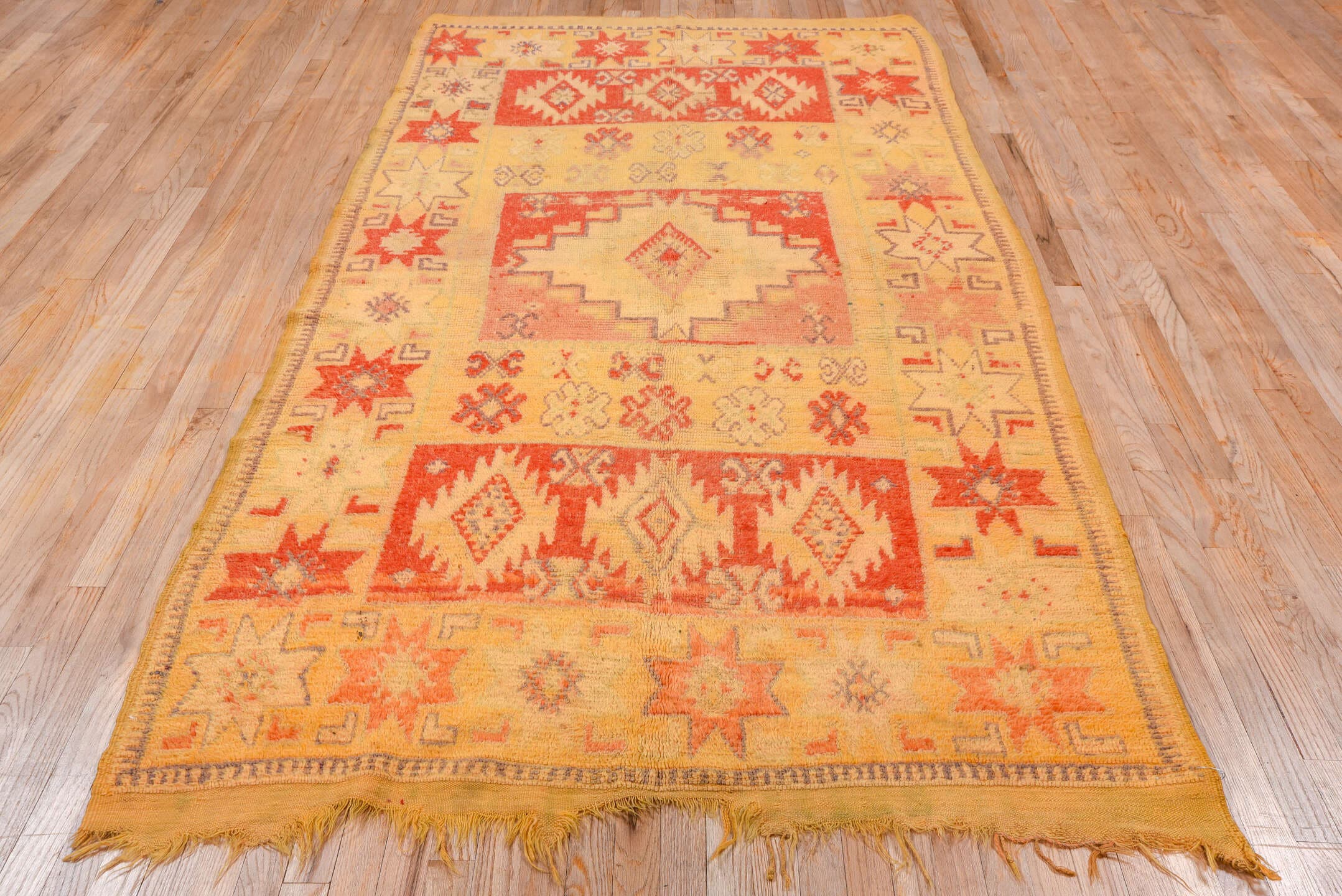 5' x 9' one-of-a-kind handmade vintage Moroccan medium size rug. Color palette: camel, rust, ivory, gold, slate, terra cotta