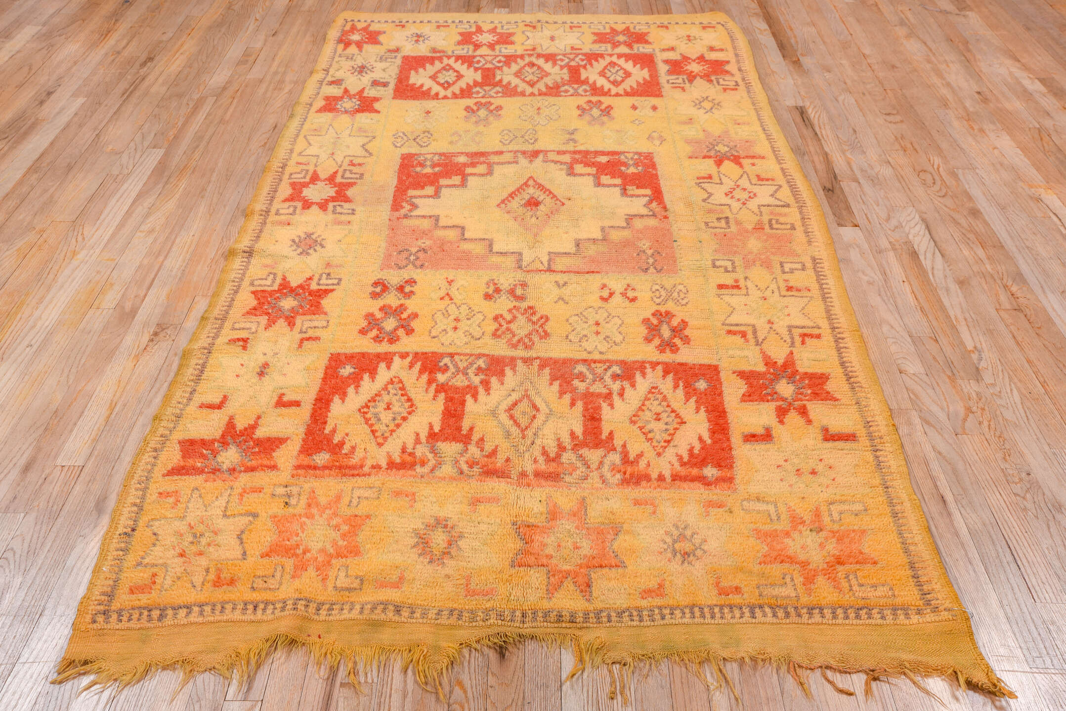 5' x 9' one-of-a-kind handmade vintage Moroccan medium size rug. Color palette: camel, rust, ivory, gold, slate, terra cotta