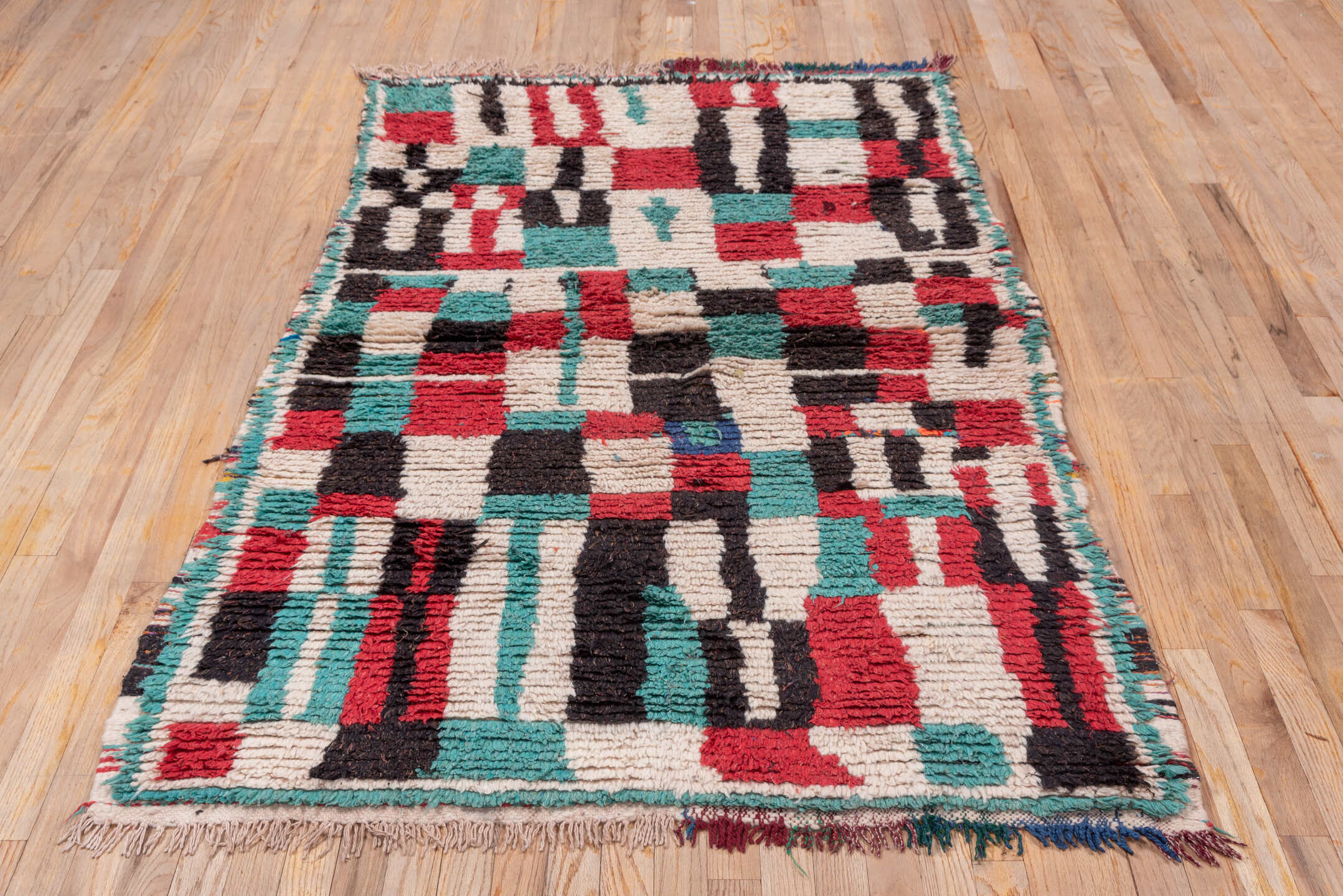 4' x 6' one-of-a-kind handmade vintage Moroccan small size rug. Color palette: ivory, turquoise, crimson, charcoal, rose