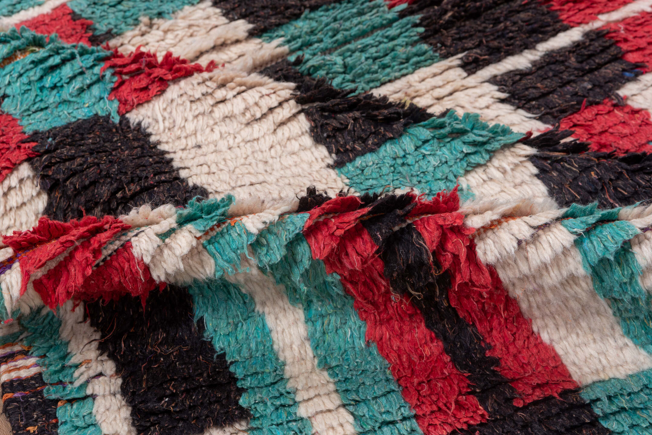 4' x 6' one-of-a-kind handmade vintage Moroccan small size rug. Color palette: ivory, turquoise, crimson, charcoal, rose