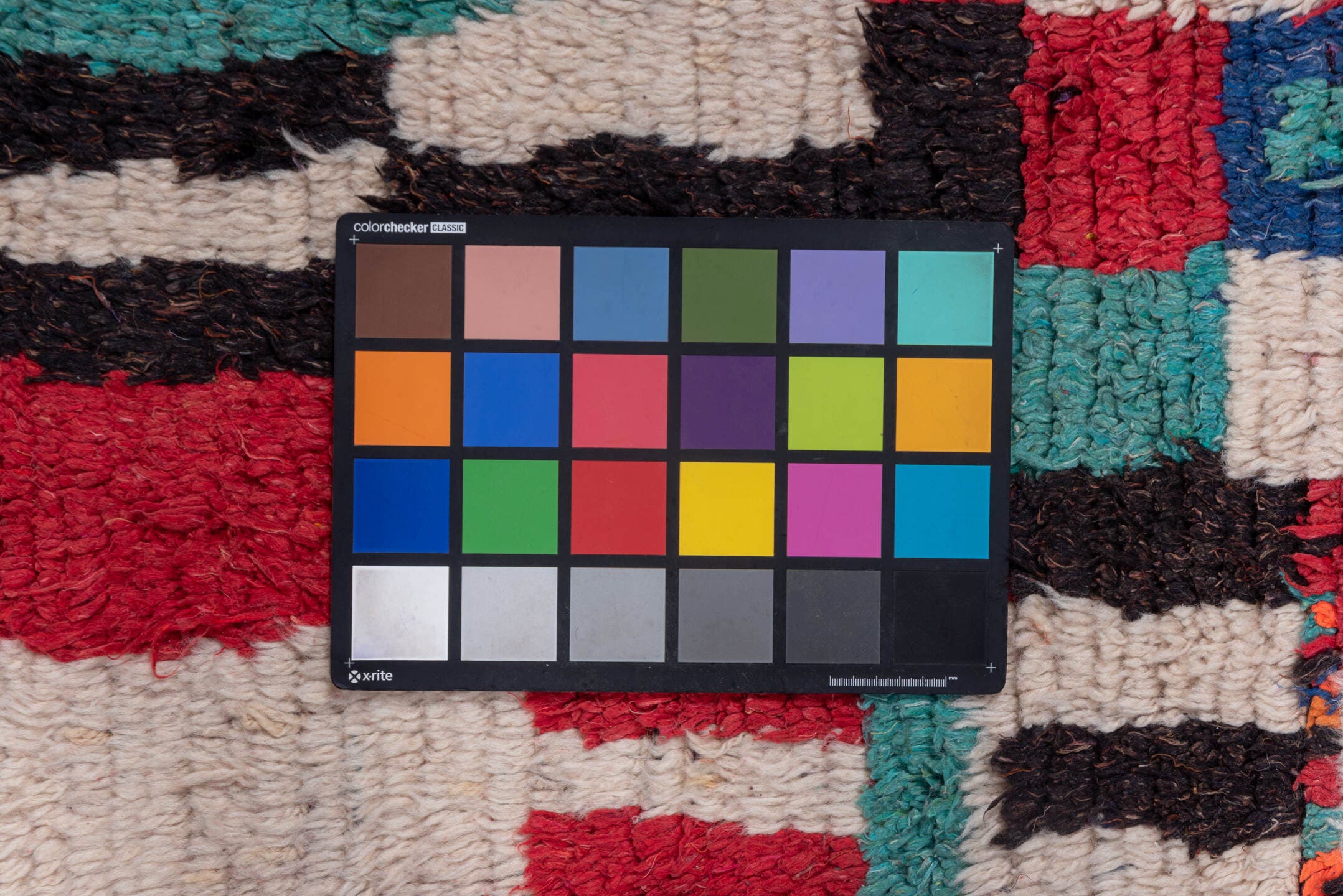 4' x 6' one-of-a-kind handmade vintage Moroccan small size rug. Color palette: ivory, turquoise, crimson, charcoal, rose