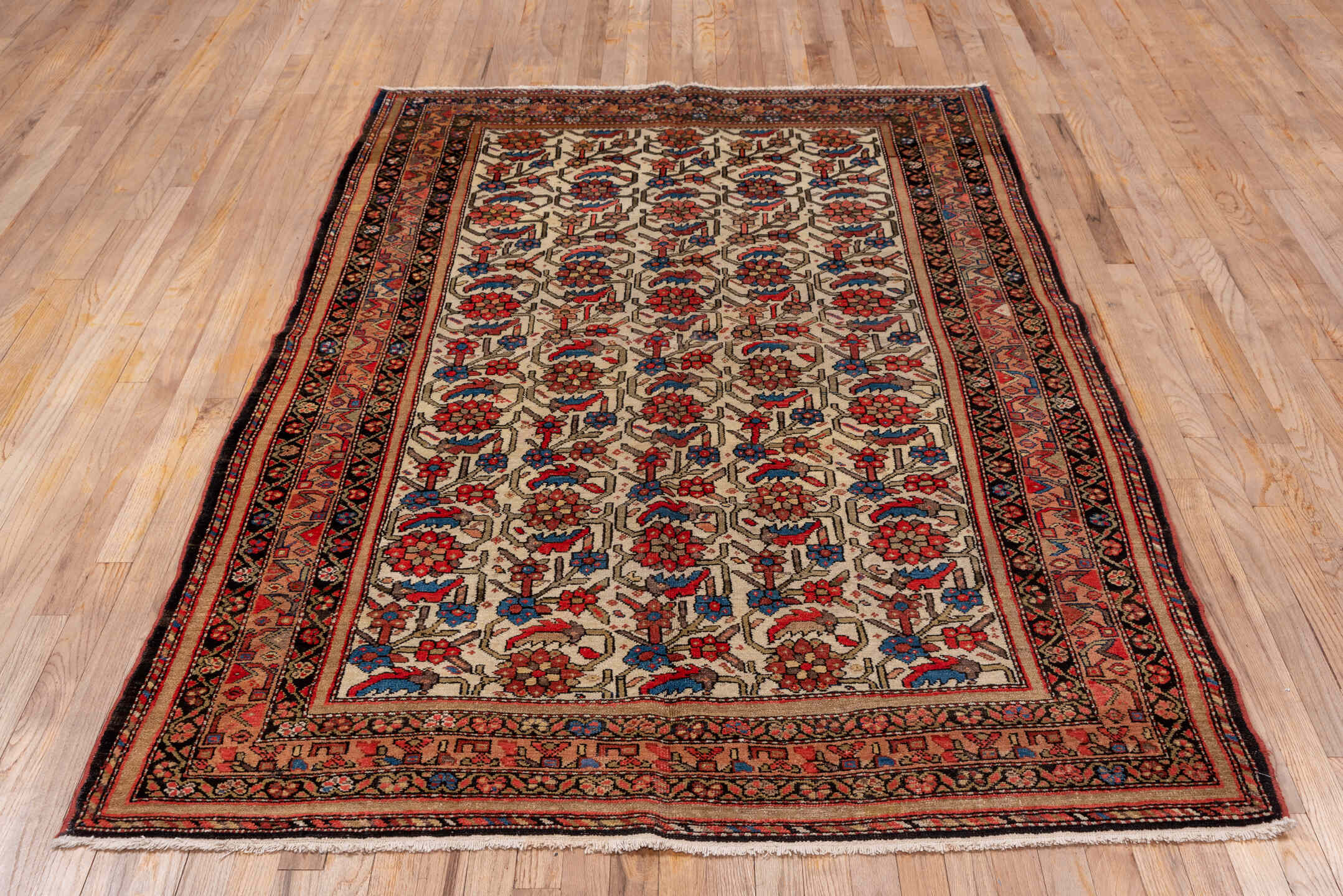 5' x 7' one-of-a-kind handmade antique Malayer rug. Color palette: ivory, rust, indigo, rose, taupe, charcoal, coral