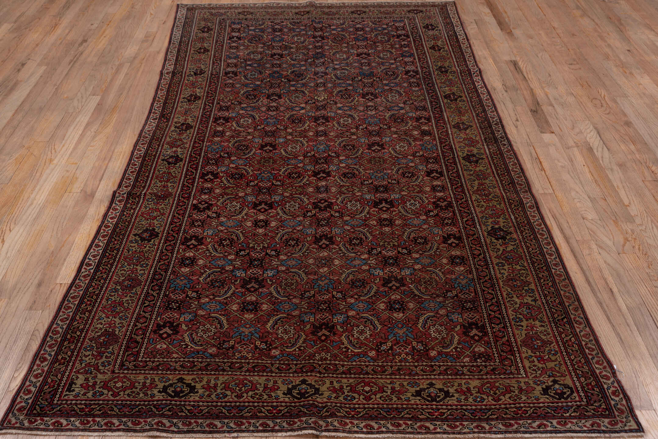 5' x 9' one-of-a-kind handmade antique Malayer medium size rug. Color palette: rust, ivory, burgundy, indigo, camel, navy