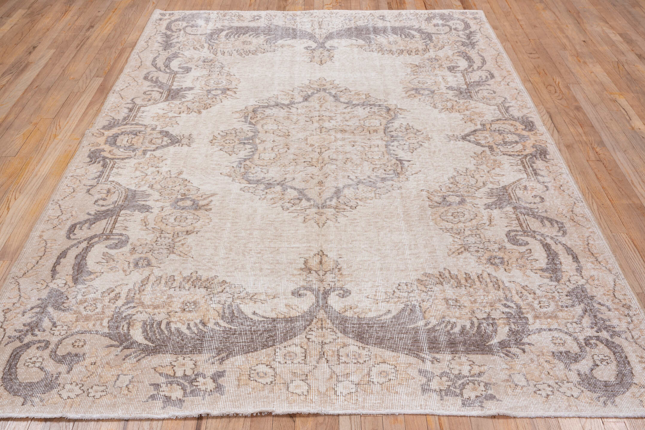 6' x 9' one-of-a-kind handmade antique Sparta medium size rug. Color palette: ivory, taupe, gray, beige, cream