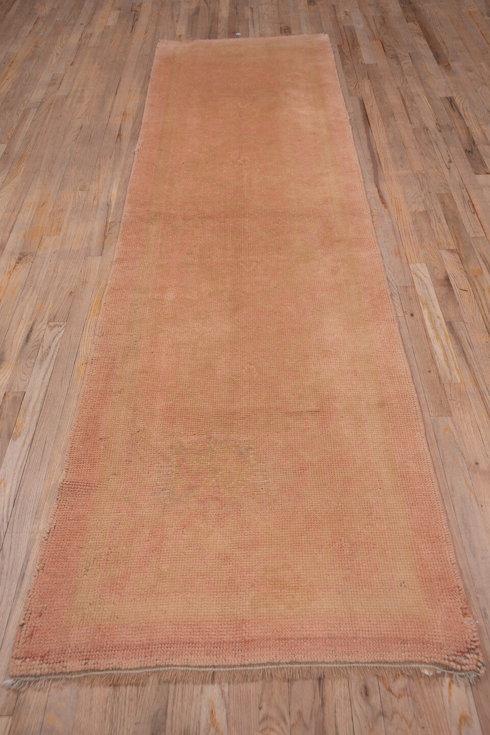 3' x 11' one-of-a-kind handmade antique Oushak runner rug. Color palette: blush, rose, peach, taupe, camel, pink, red