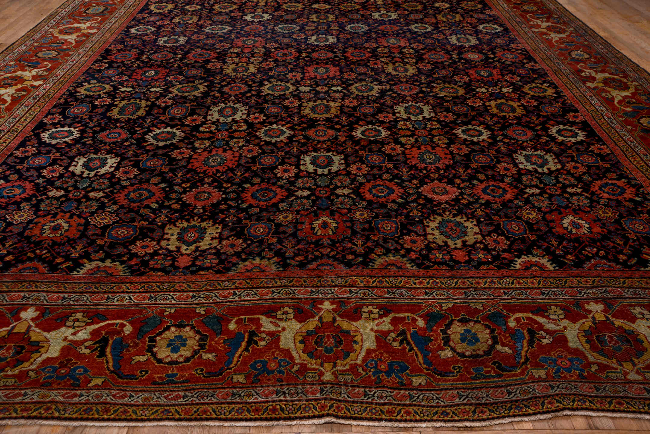 14' x 19' one-of-a-kind handmade antique Sultanabad oversize rug. Color palette: navy, rust, ivory, sky blue, terra cotta