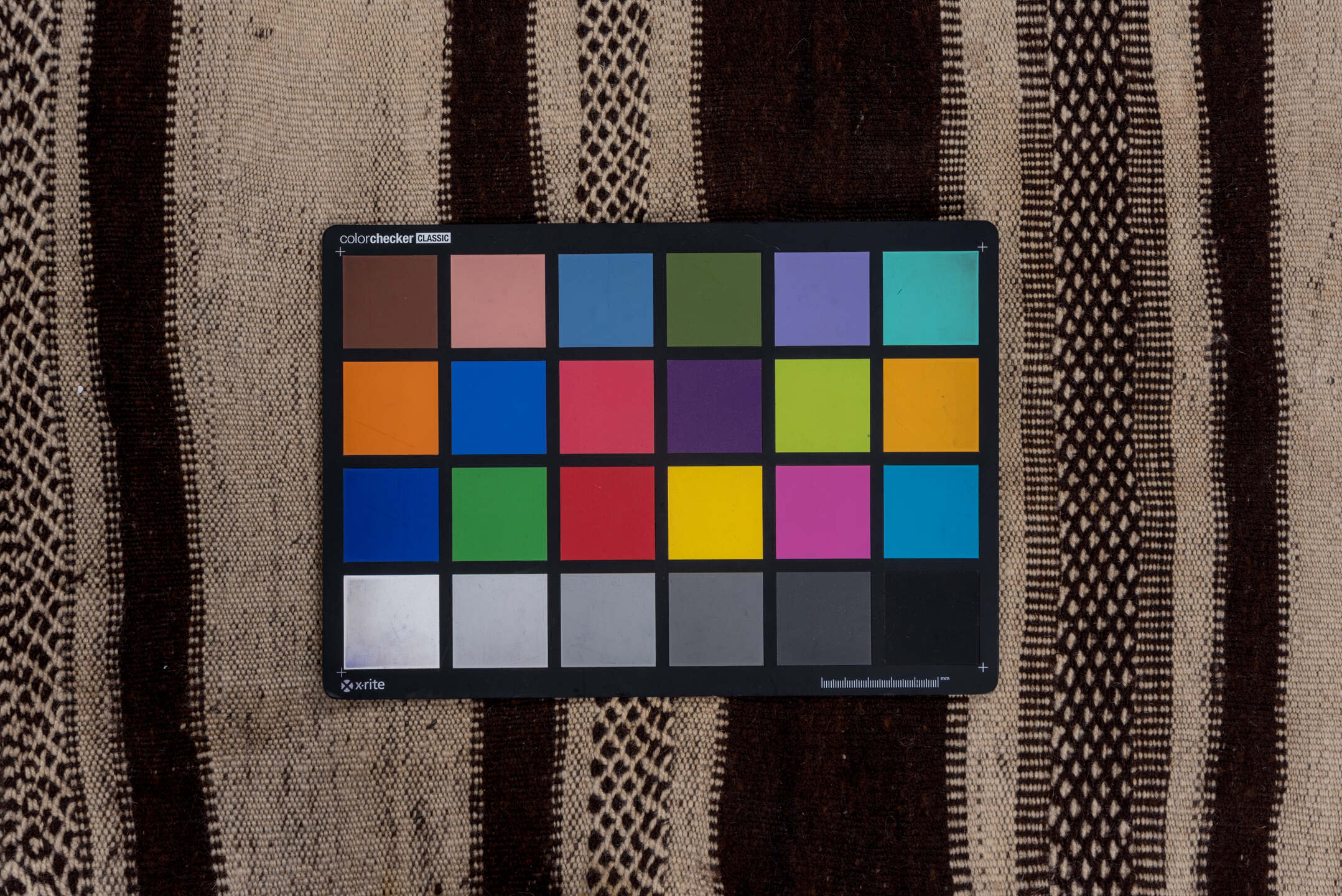 4' x 10' one-of-a-kind handmade vintage Blanket runner rug. Color palette: brown, gray, light gray, off-white, pink