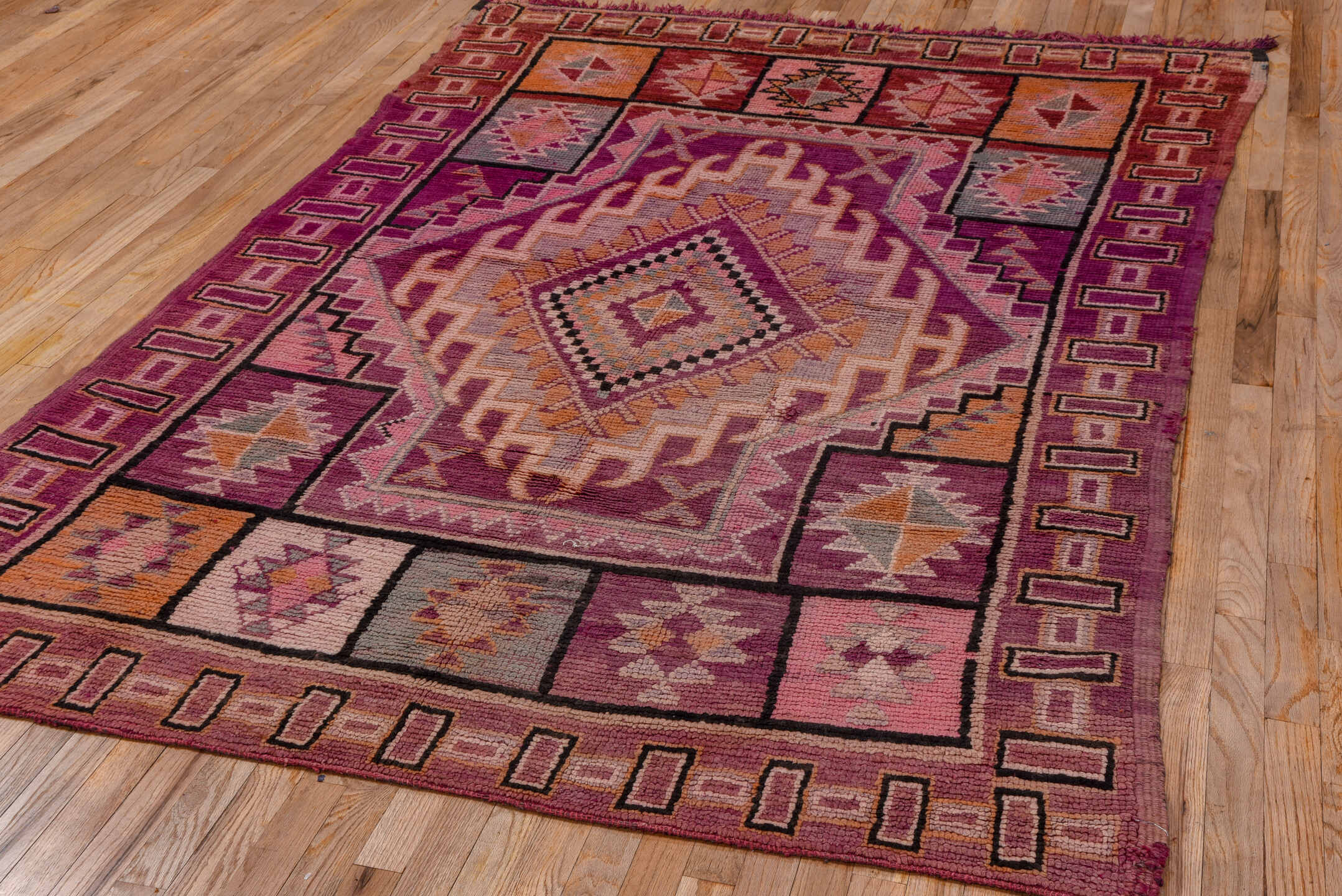 5' x 8' one-of-a-kind handmade vintage Moroccan medium size rug. Color palette: magenta, rose, mauve, peach, plum, lavender