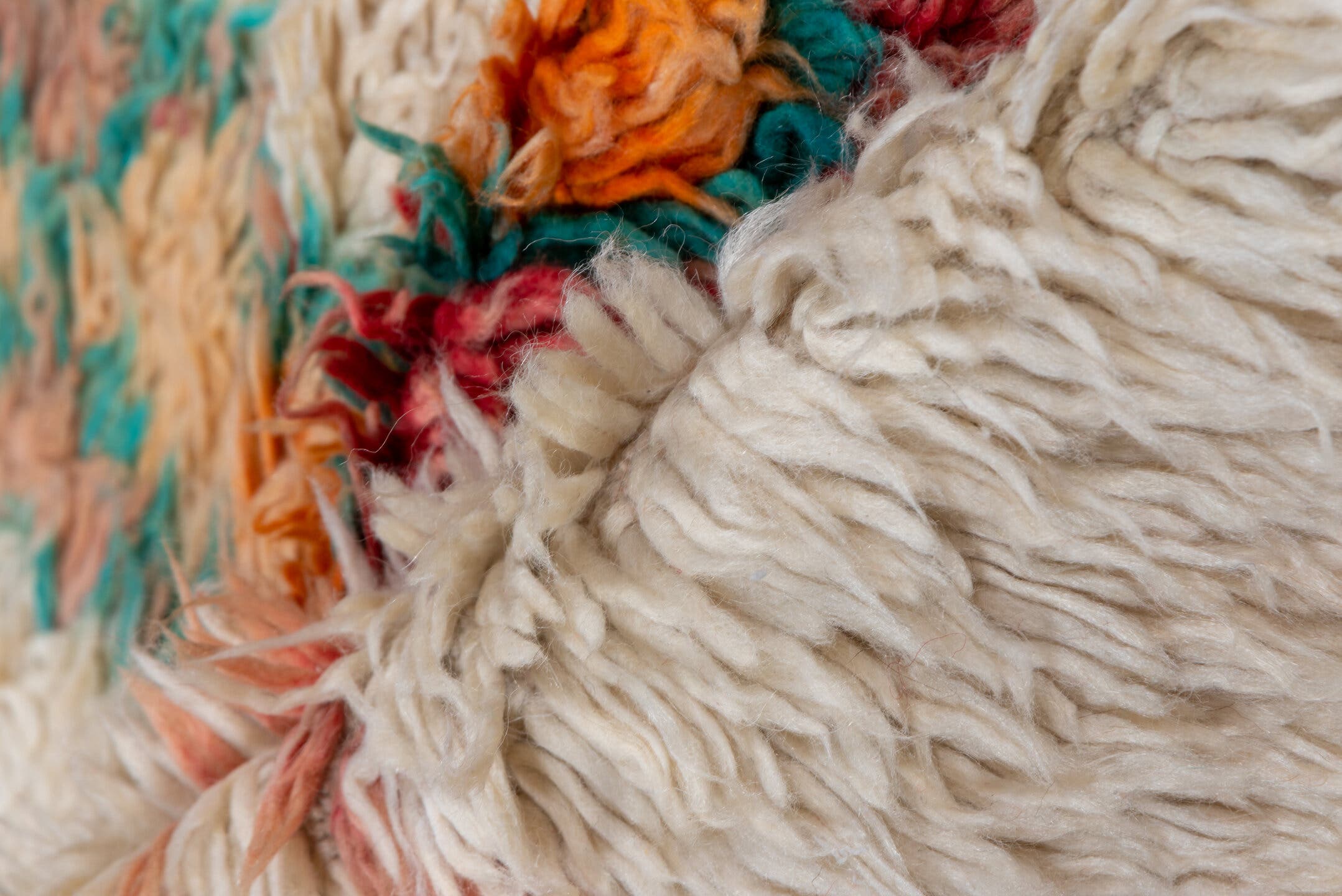5' x 9' one-of-a-kind handmade vintage Moroccan medium size rug. Color palette: ivory, peach, teal, coral, orange, red