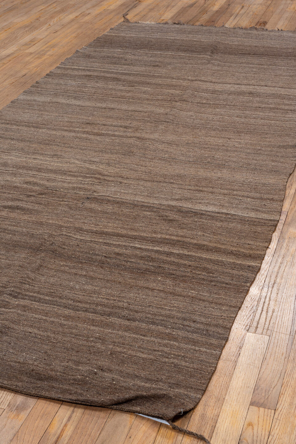 4' x 9' one-of-a-kind handmade vintage Blanket runner rug. Color palette: brown, taupe, camel, charcoal, beige, gray, black