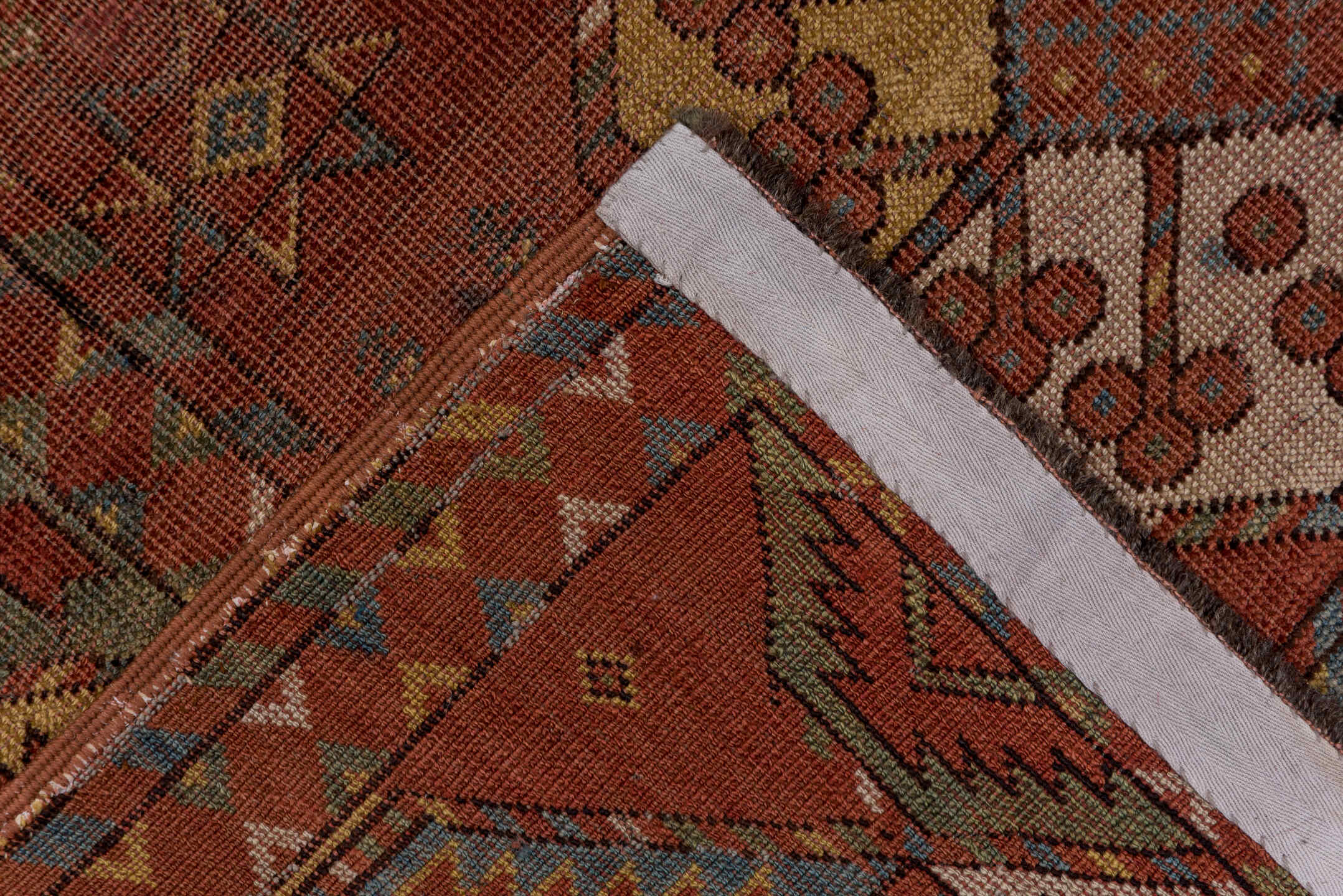 7' x 11' one-of-a-kind handmade antique Afghan large size rug. Color palette: rust, terra cotta, camel, ivory, slate blue