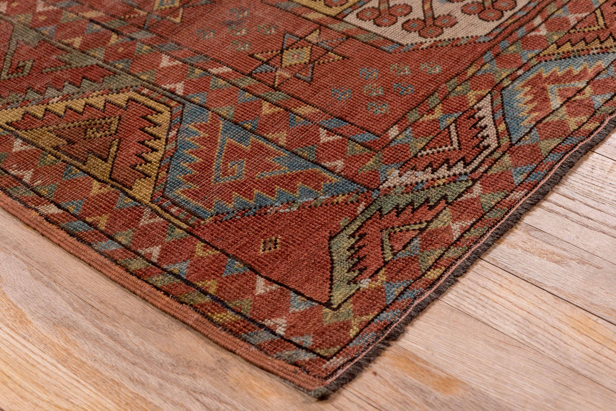 7' x 11' one-of-a-kind handmade antique Afghan large size rug. Color palette: rust, terra cotta, camel, ivory, slate blue