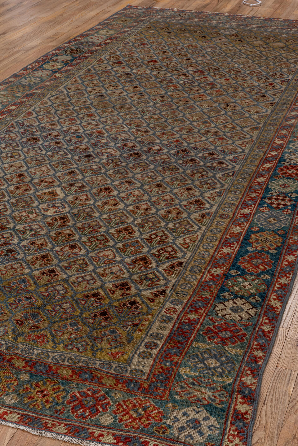 5' x 12' one-of-a-kind handmade antique NW Persian rug. Color palette: camel, ivory, slate, rust, blue, taupe, charcoal