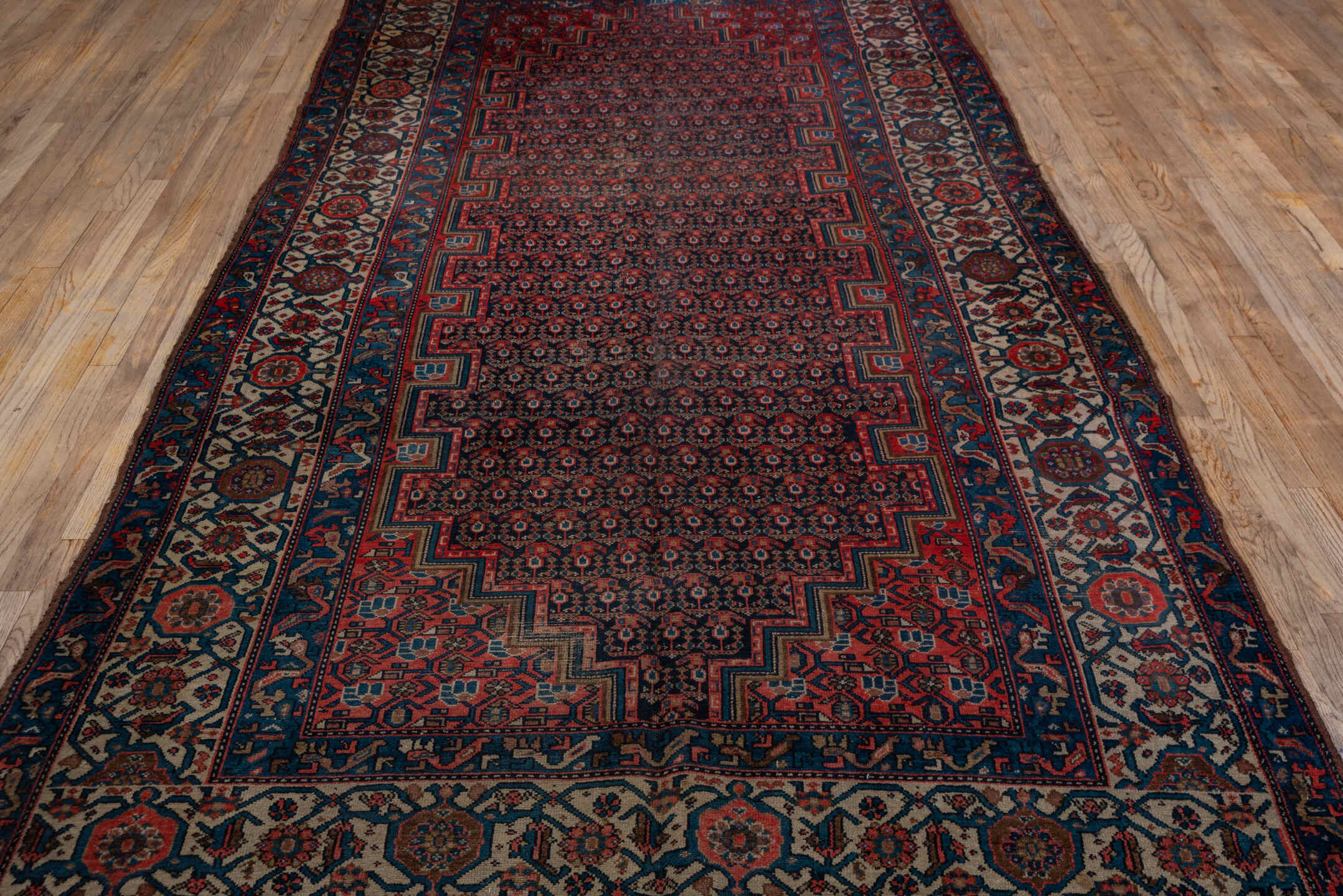 5' x 11' one-of-a-kind handmade vintage Malayer rug. Color palette: black, blue, brown, charcoal, gray, pink, red