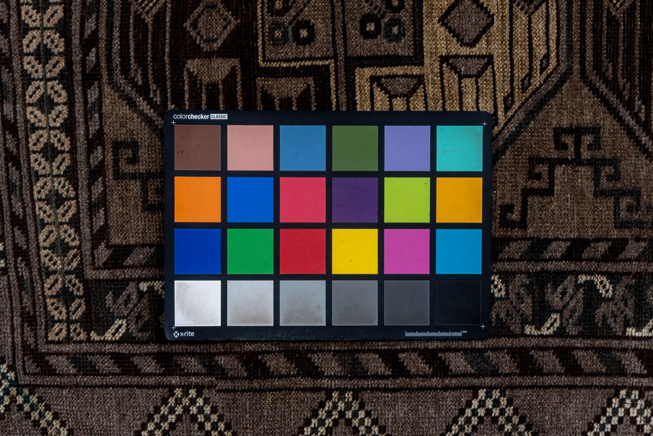 7' x 10' one-of-a-kind handmade vintage Afghan large size rug. Color palette: black, brown, gray, light gray, off-white