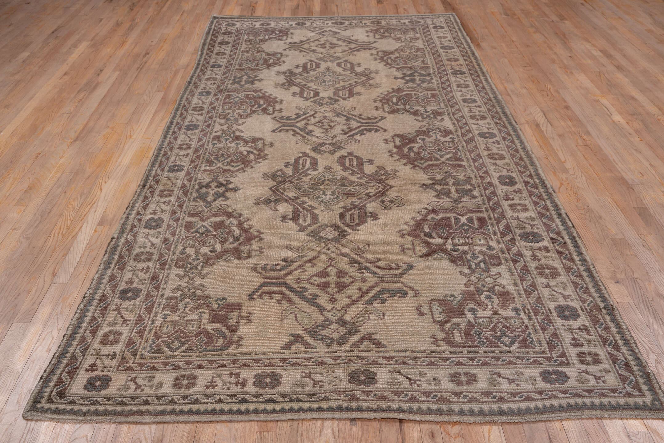 6' x 12' one-of-a-kind handmade antique Oushak large size rug. Color palette: ivory, taupe, rose, brown, mauve, charcoal