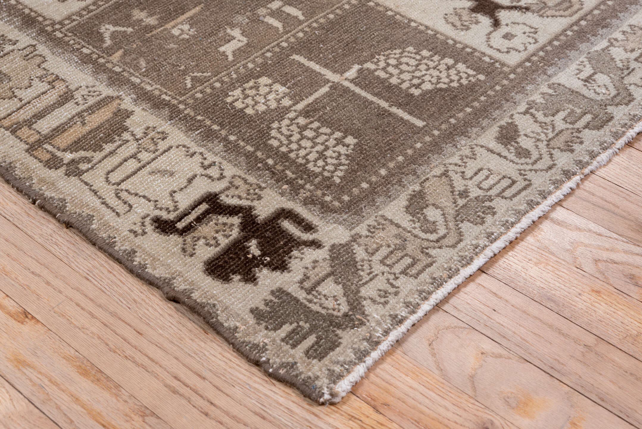5' x 9' one-of-a-kind handmade antique Baktiary medium size rug. Color palette: taupe, brown, ivory, charcoal, camel, beige