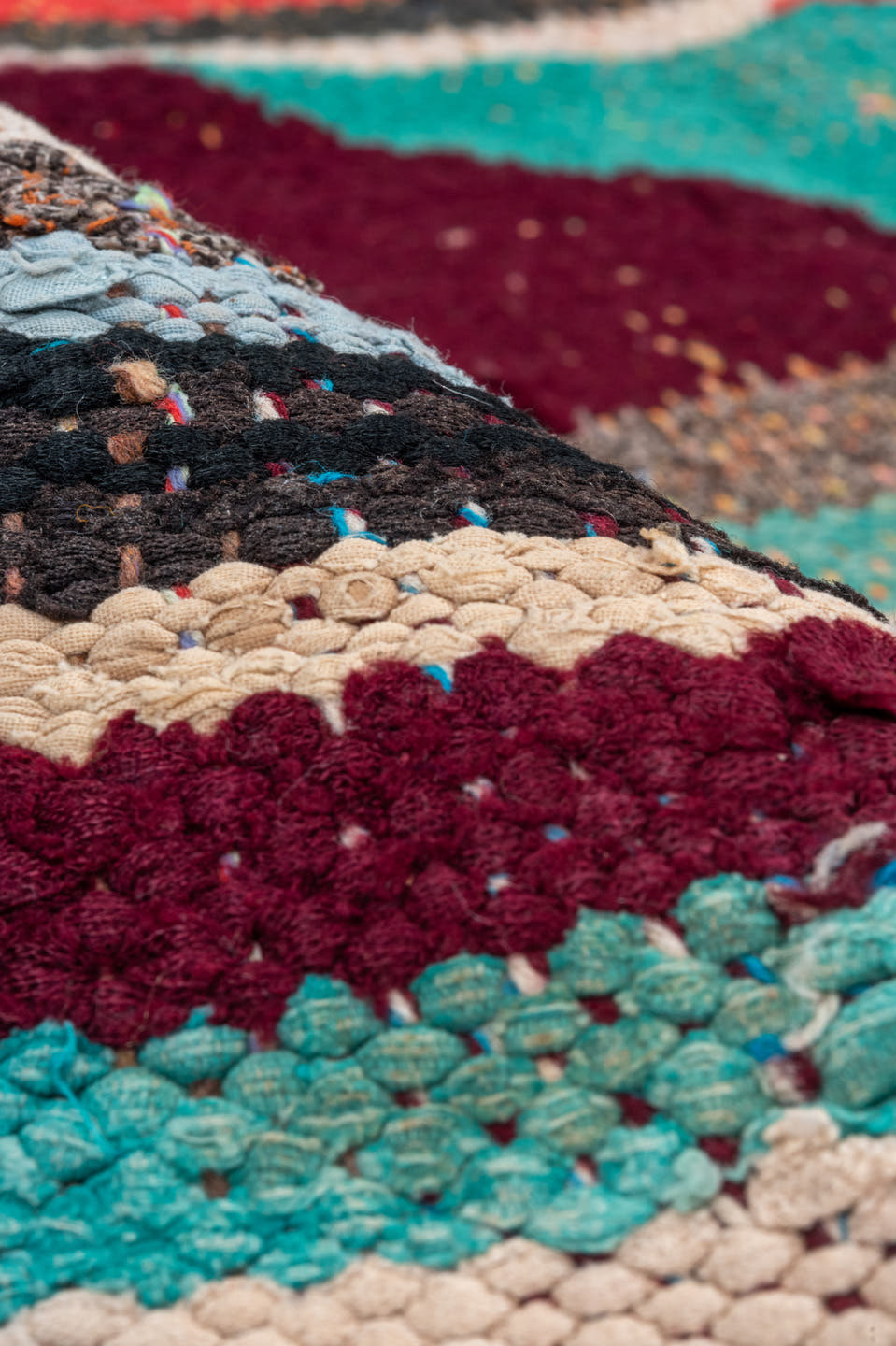 4' x 5' one-of-a-kind handmade vintage Rag Rug small size rug. Color palette: ivory, turquoise, charcoal, coral, burgundy