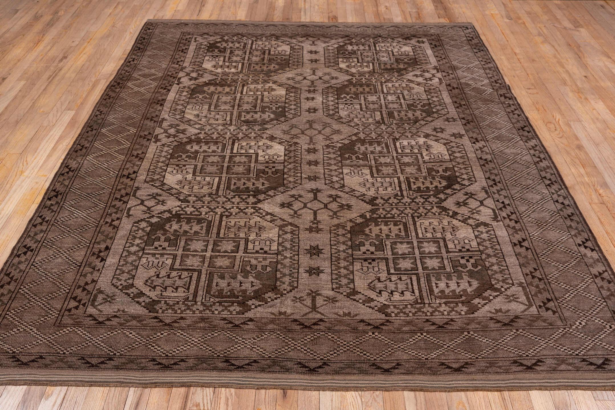 6' x 9' one-of-a-kind handmade vintage Afghan medium size rug. Color palette: brown, gray, light gray, off-white, pink
